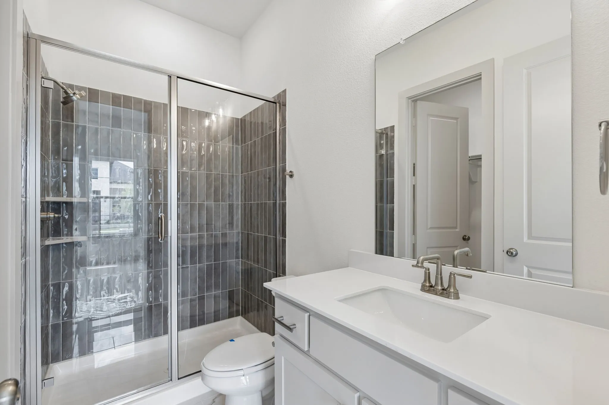 Friends and family will feel right at home in any of the beautifully finished guest baths.