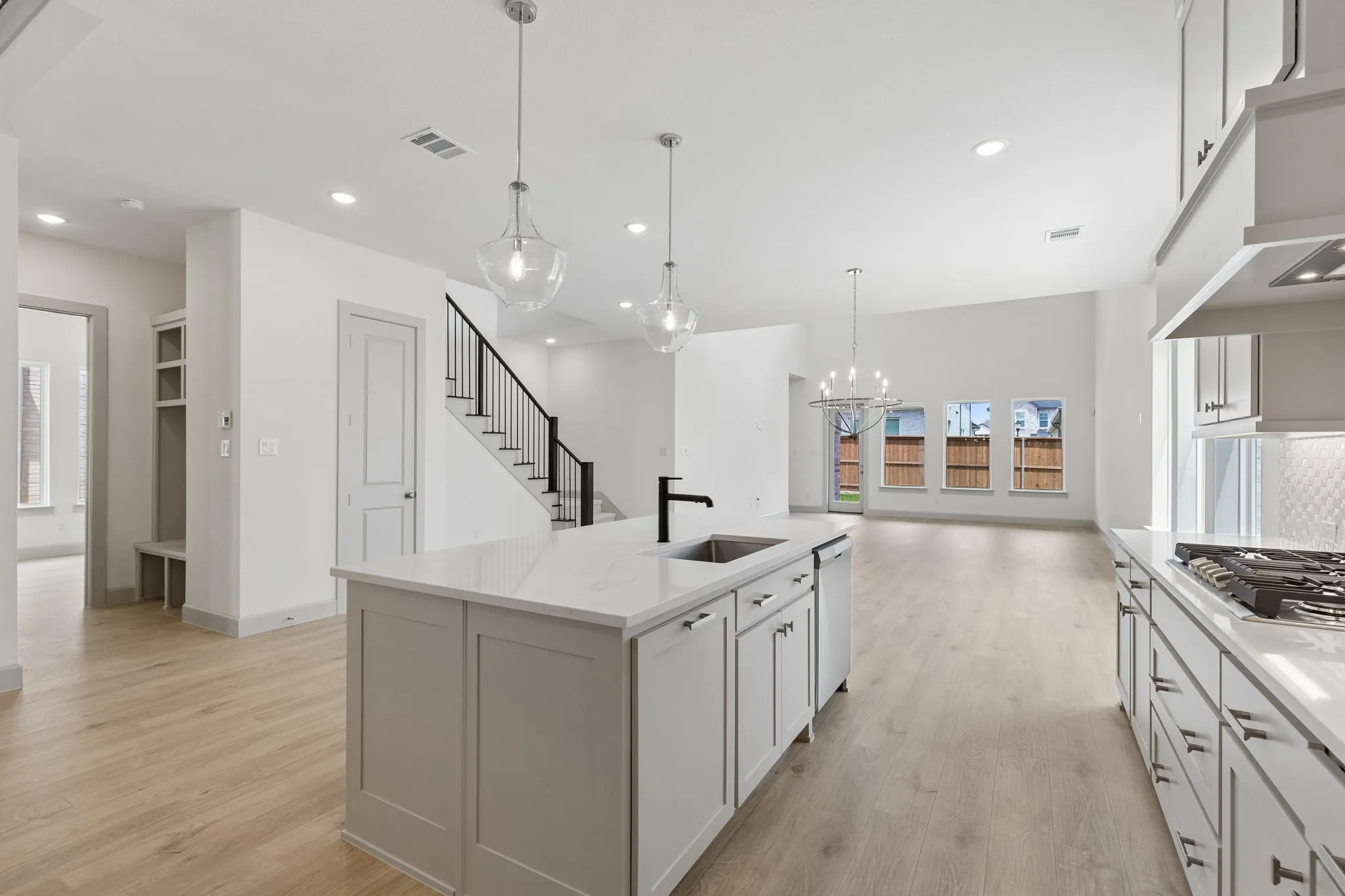 The spacious island sits center stage in this dream kitchen and offers the perfect place for friends and family to gather round!