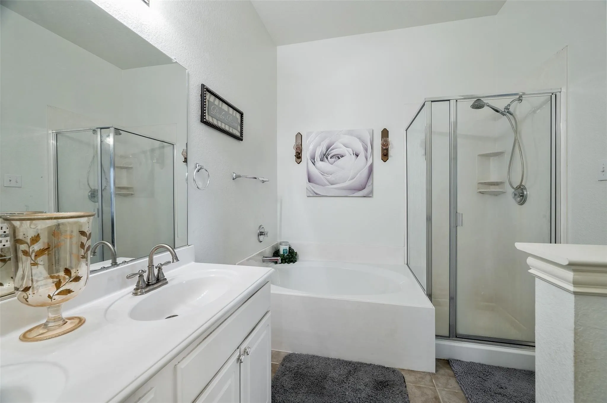 Full bathroom with a shower stall, vanity, tile patterned flooring, and a garden tub