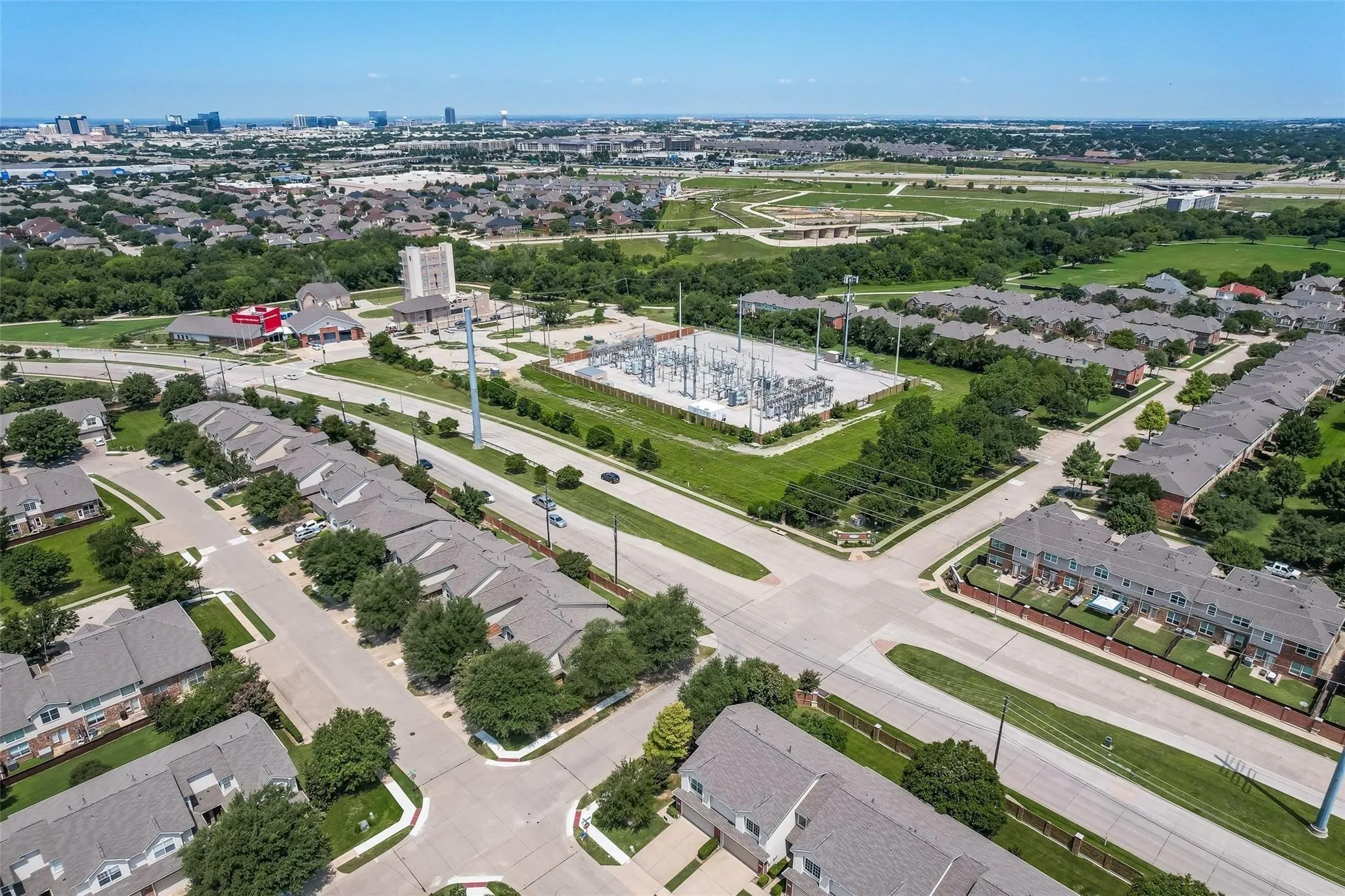 Established residential community with multiple rows of townhomes and ample green spaces