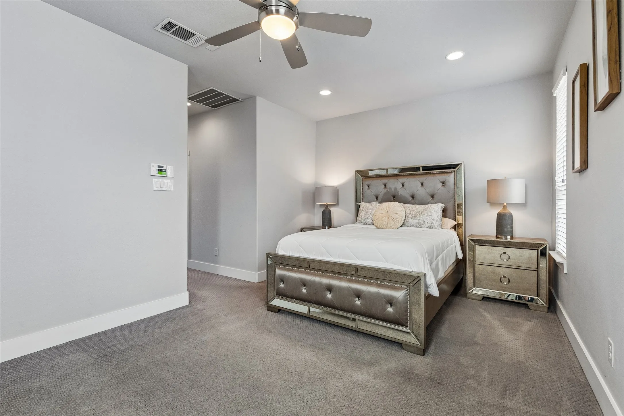 Recessed lighting, ceiling fan, carpeted flooring, and window with blinds