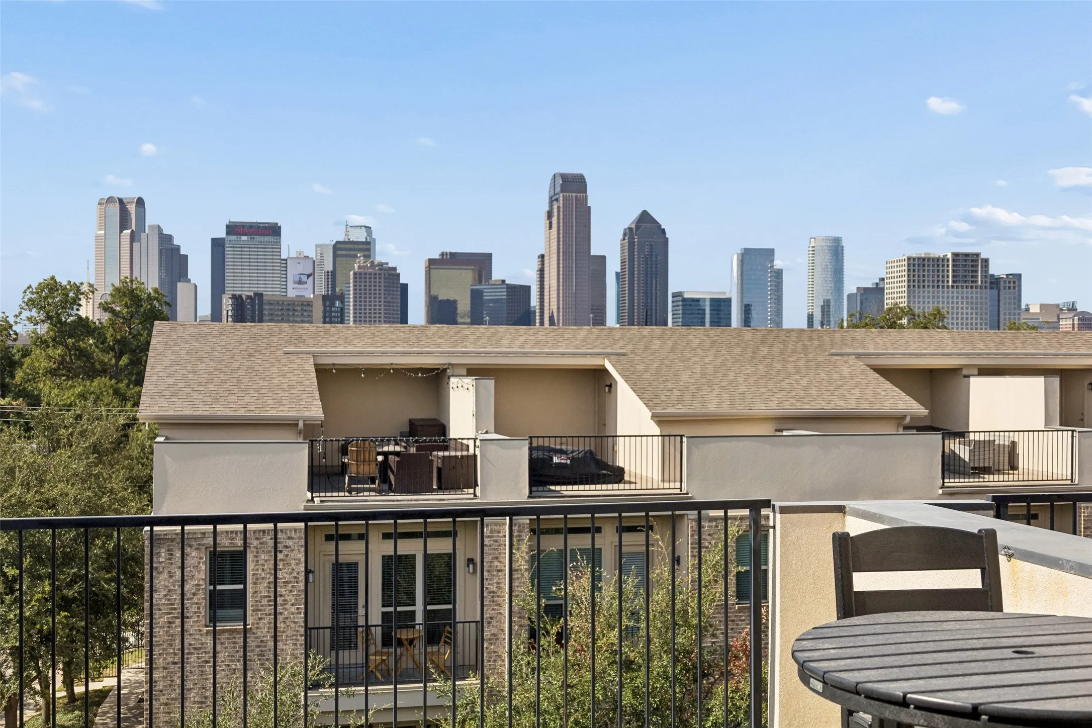 Expansive rooftop terrace with a cityscape backdrop