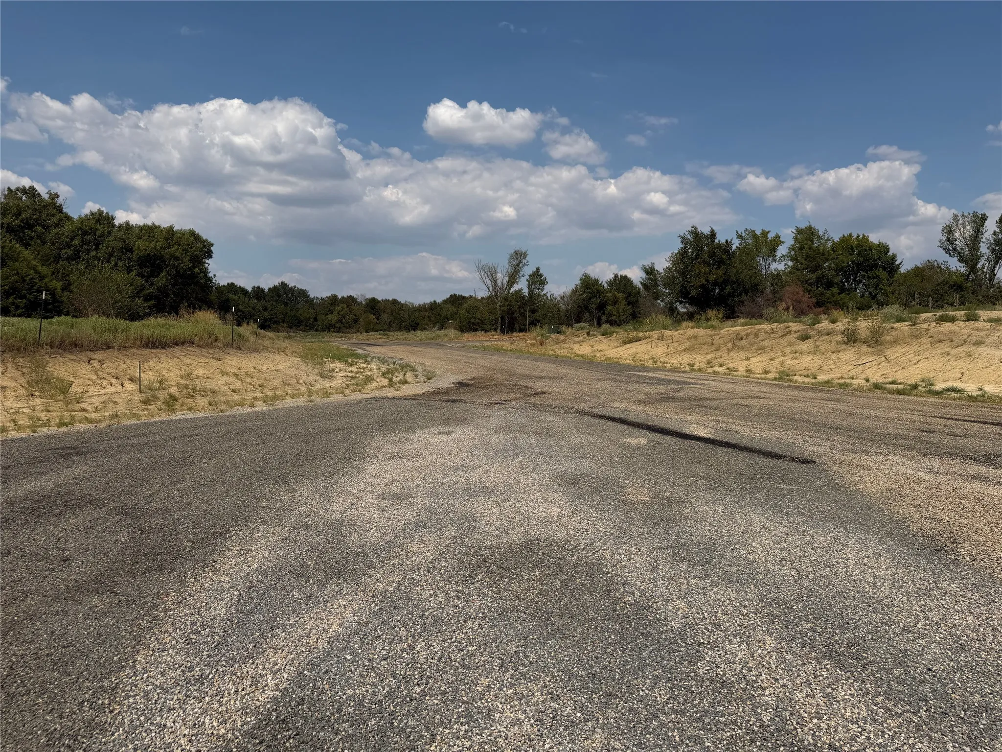 Gravel road with a natural landscape backdrop