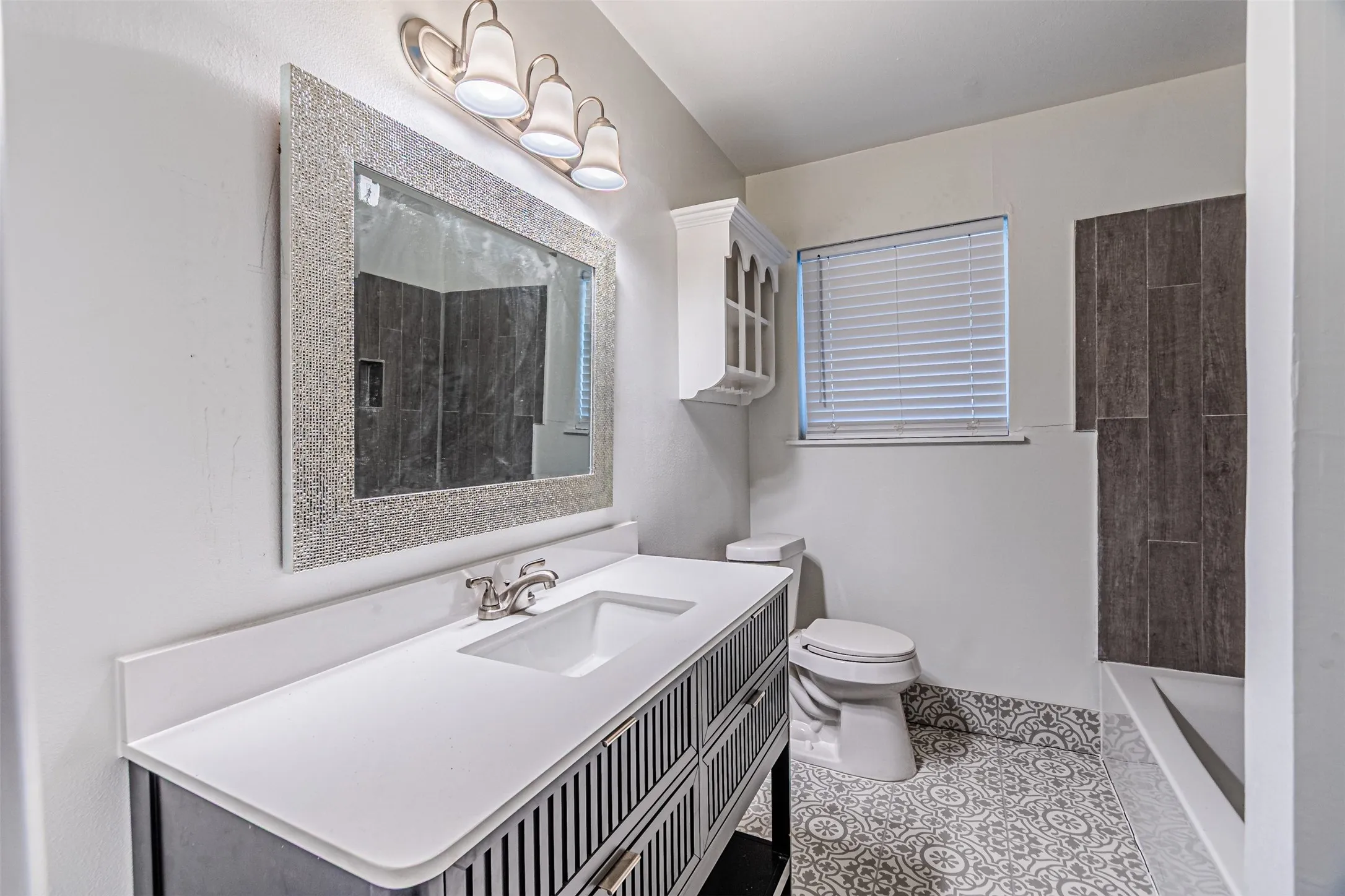 Modern vanity with an integrated sink and brushed nickel faucet