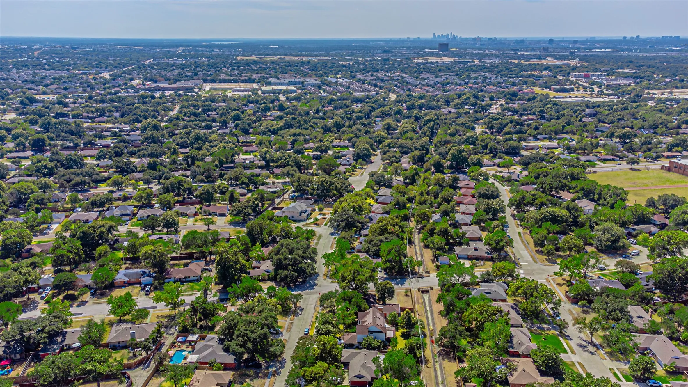 Expansive residential area featuring mature tree canopy and established roadways