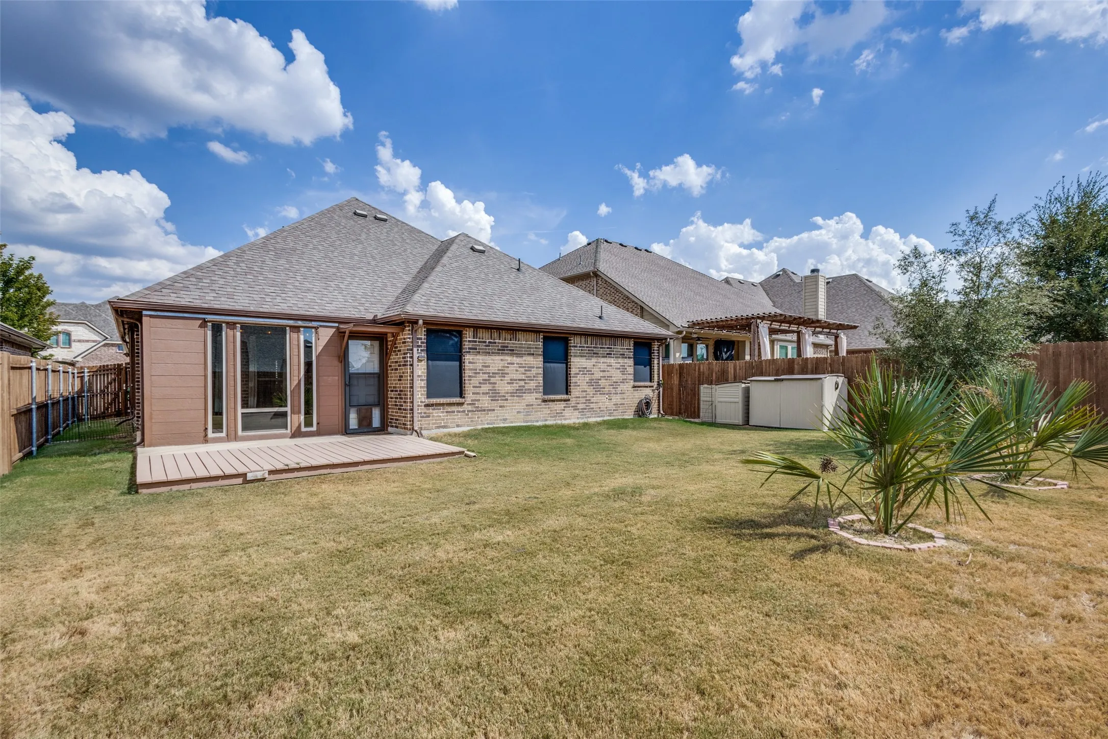 The backyard has plenty of space for entertaining or for kids to play.