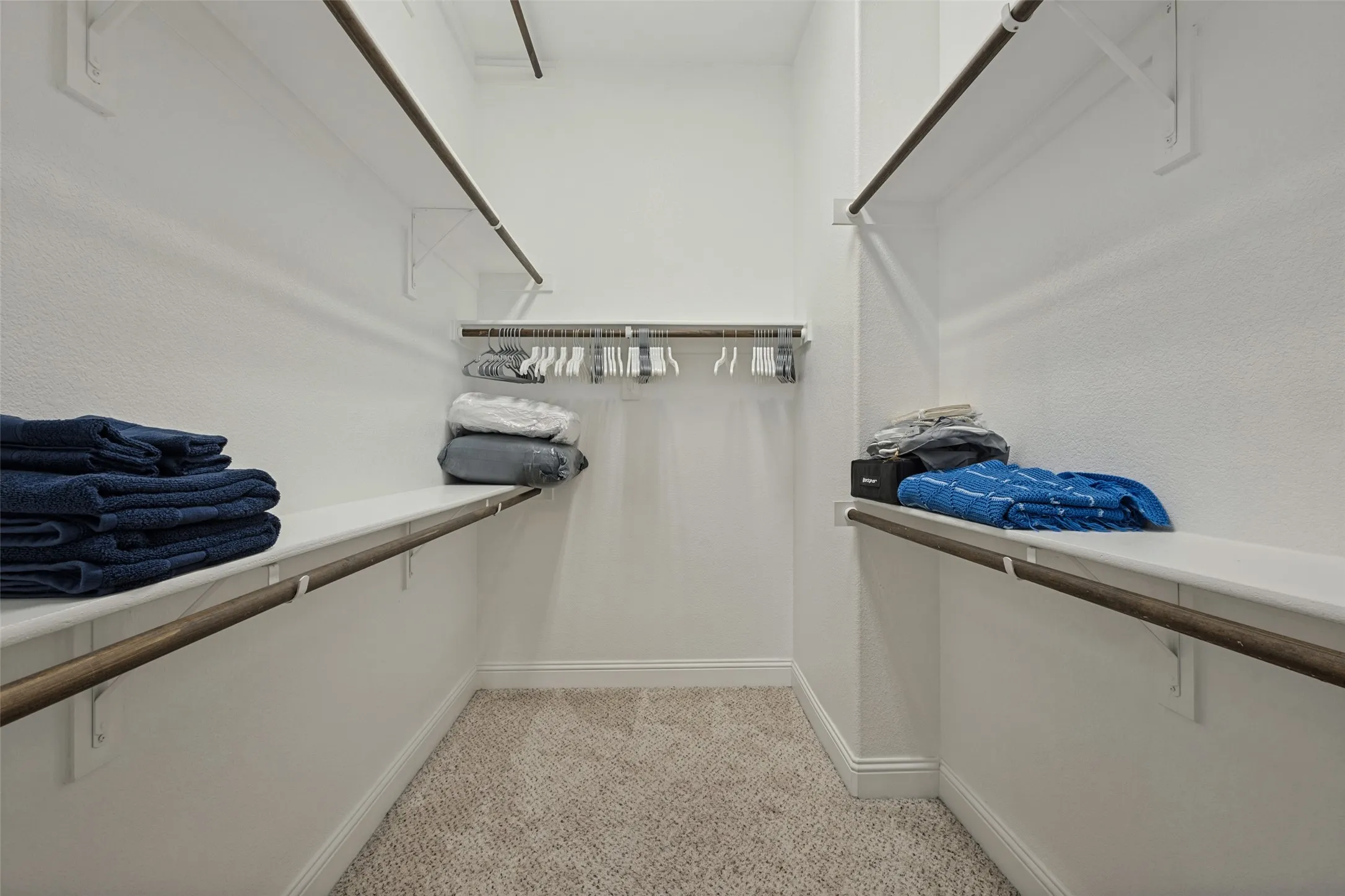 The master closet has 3 stack seasonal hanging racks. There are plenty of towels and bedding items throughout the home.