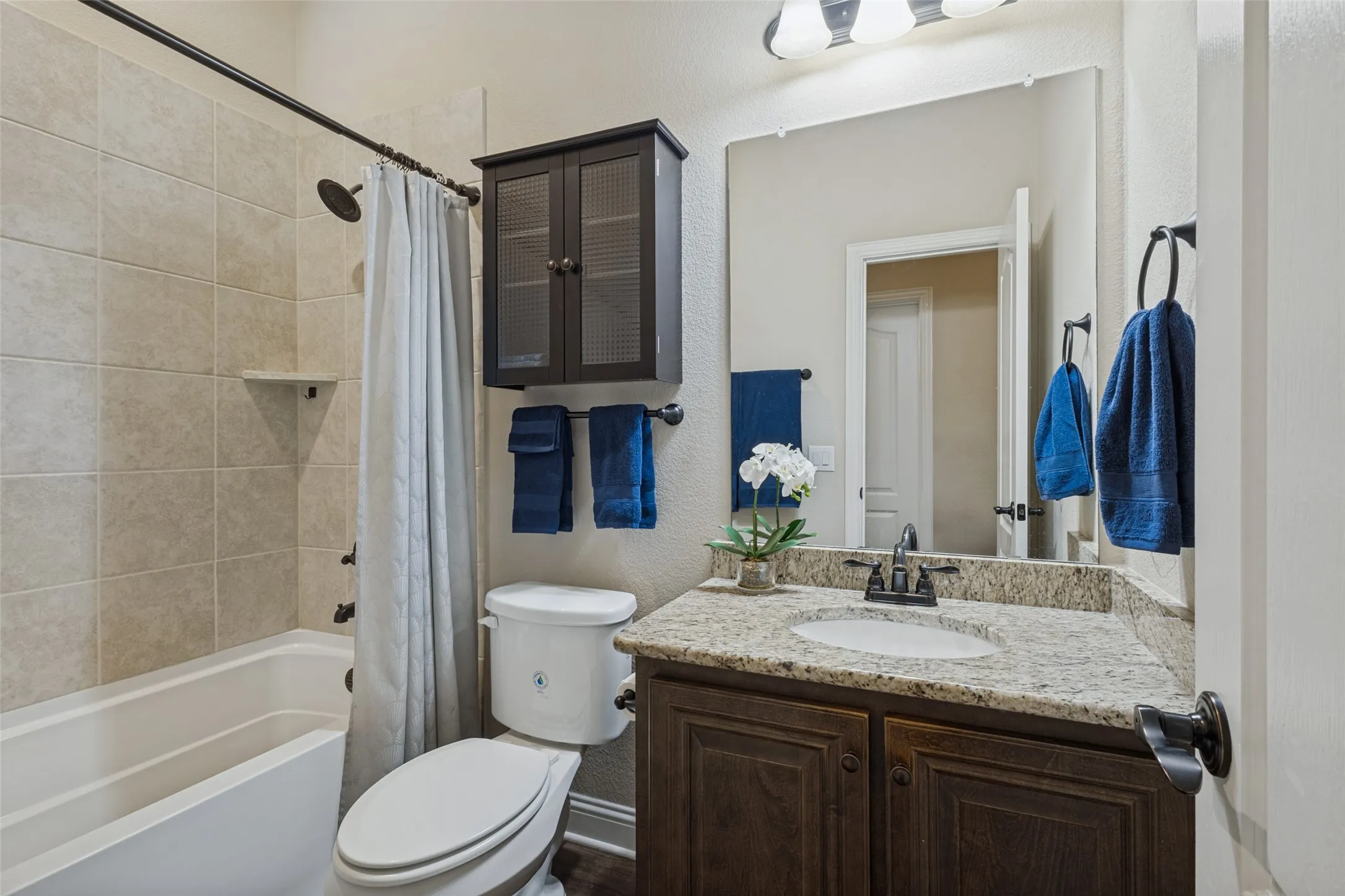 Secondary bathroom for 3 bedrooms that are split from the master bedroom.