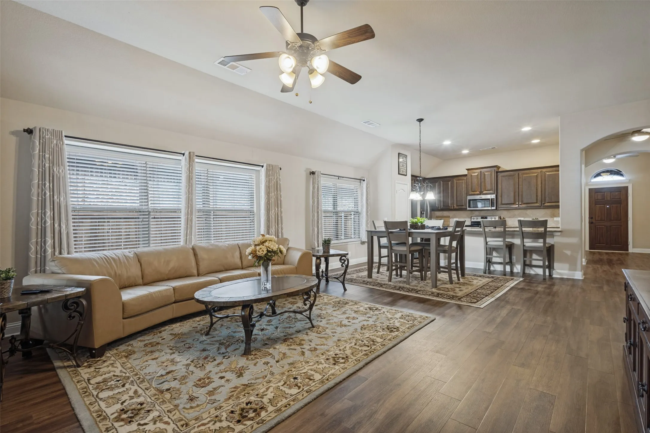 Open concept living and dining areas with 10' ceilings.