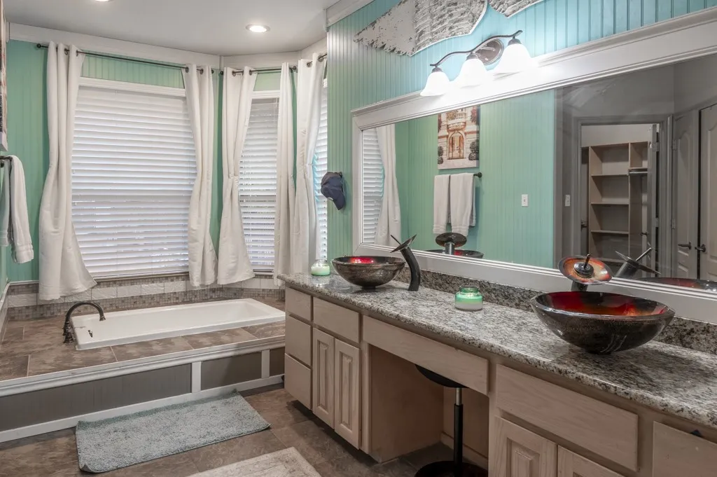 Ensuite Bathroom with Jetted tub, Double Sinks,  Vanity, Shower and Toilet Room, and Walk In Closet