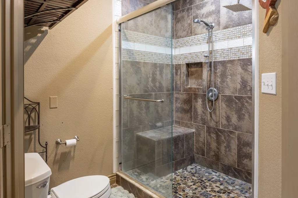Separate Master Shower and Toilet Room. Double Entry Doors Not Pictured.