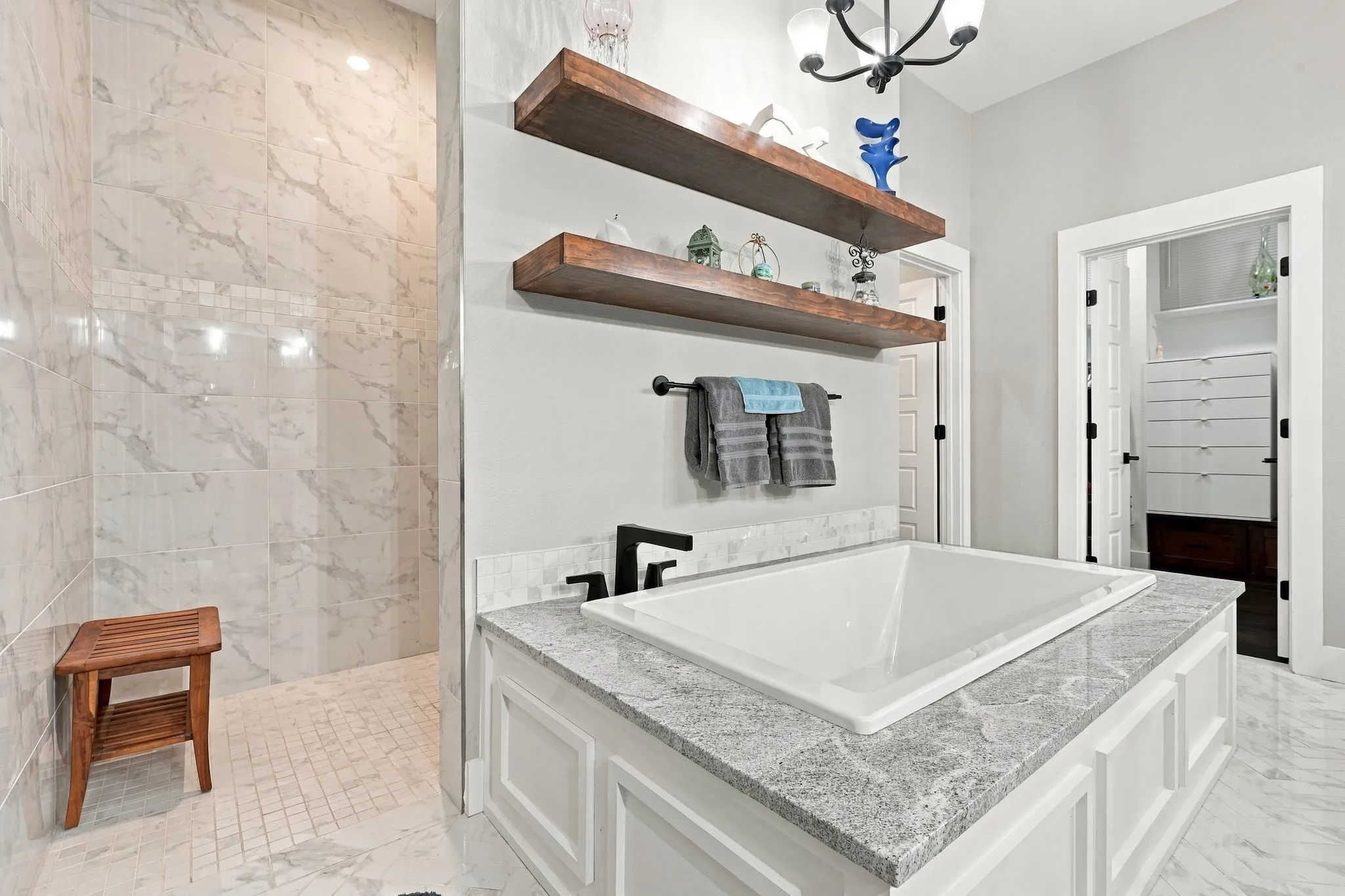 Primary bathroom with large walk-in shower and bathtub