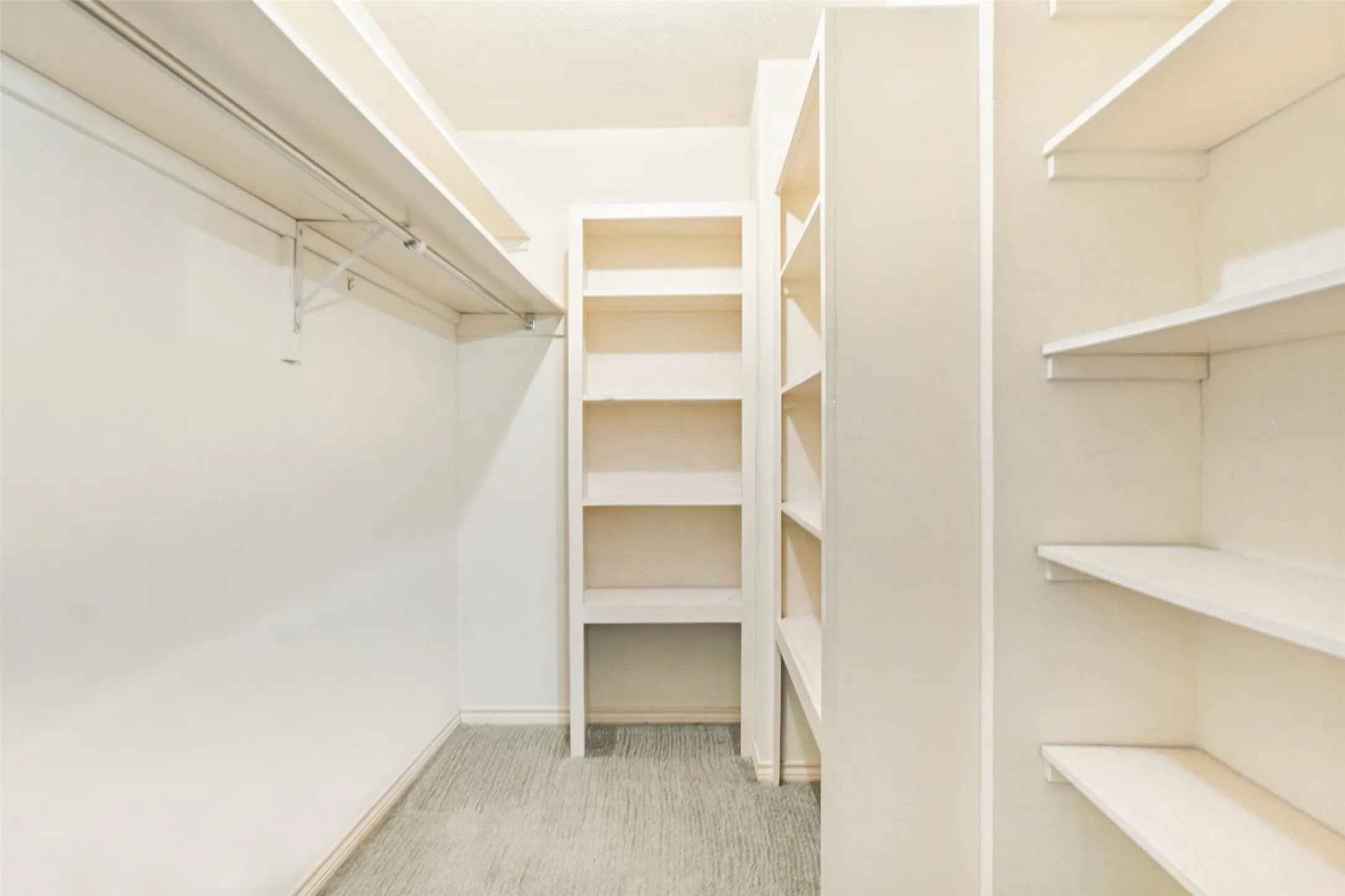 915 Grinnell Dr. - Large walk-in closet located just off the den, featuring built-in shelving and abundant organized storage.