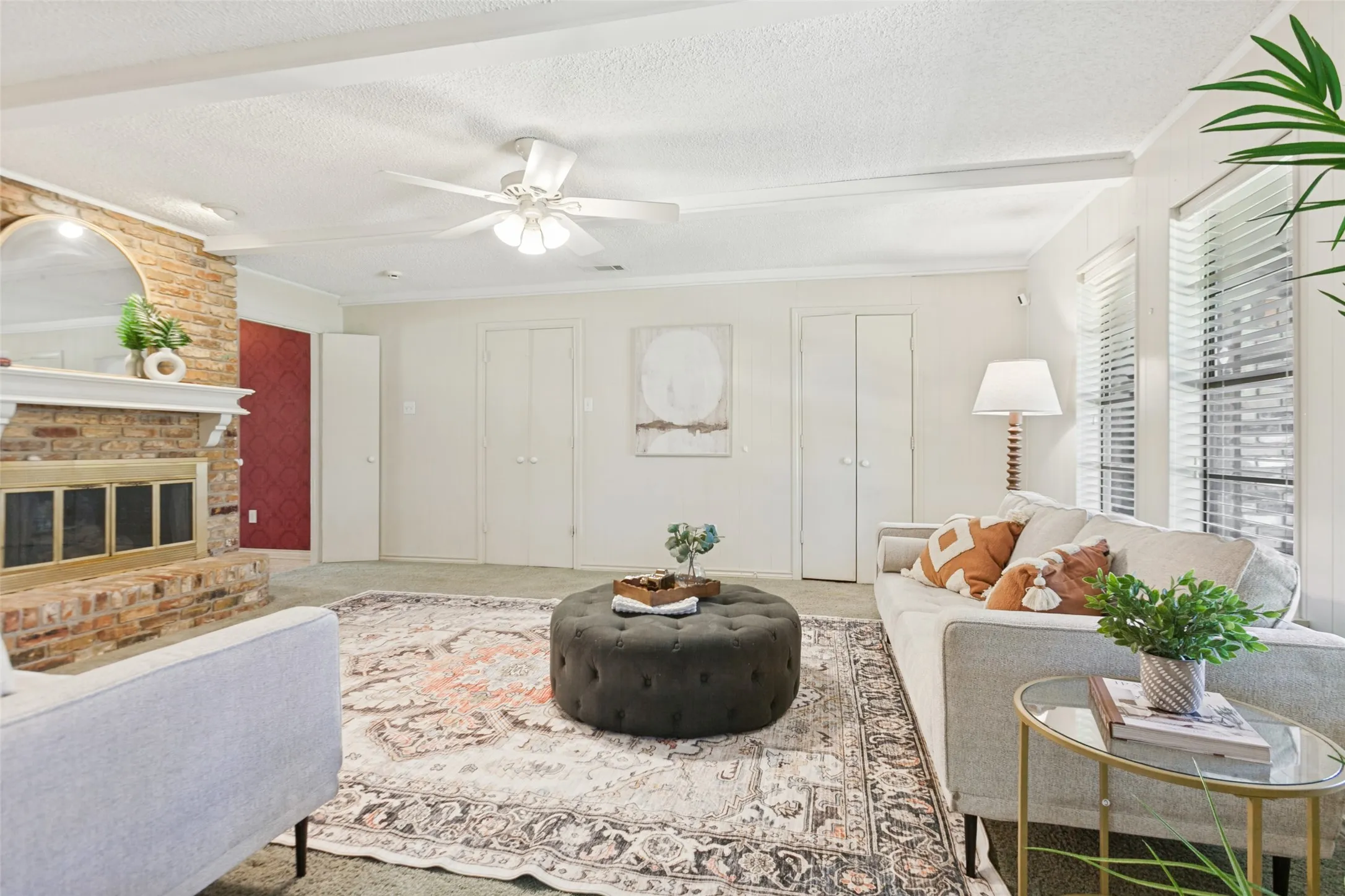 915 Grinnell Dr. - Spacious den featuring windows overlooking the back porch, a beautiful brick fireplace with built-in storage, and an attached walk-in closet providing exceptional additional storage