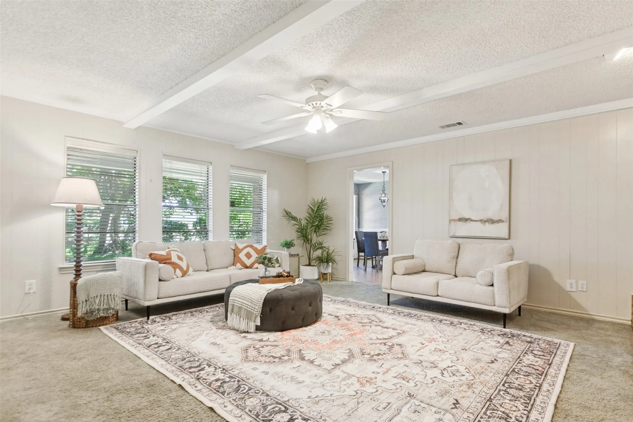 915 Grinnell Dr. - Spacious den featuring windows overlooking the back porch, a beautiful brick fireplace with built-in storage, and an attached walk-in closet providing exceptional additional storage