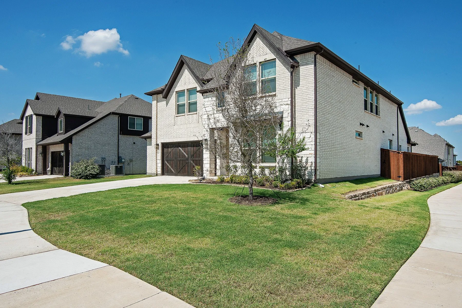 Stone and brick exterior with dark trim accents