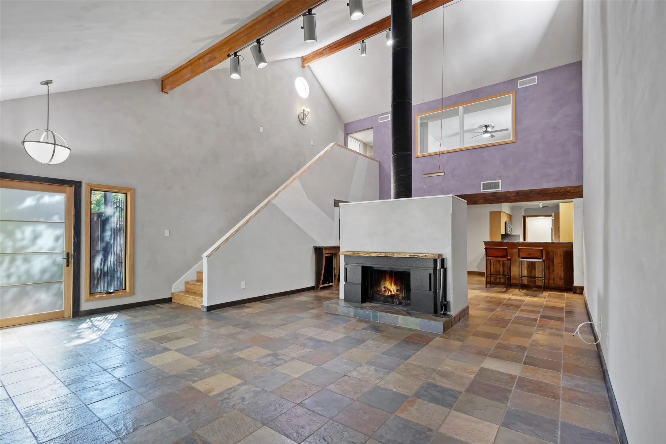 Open floor plan with view of kitchen from living area