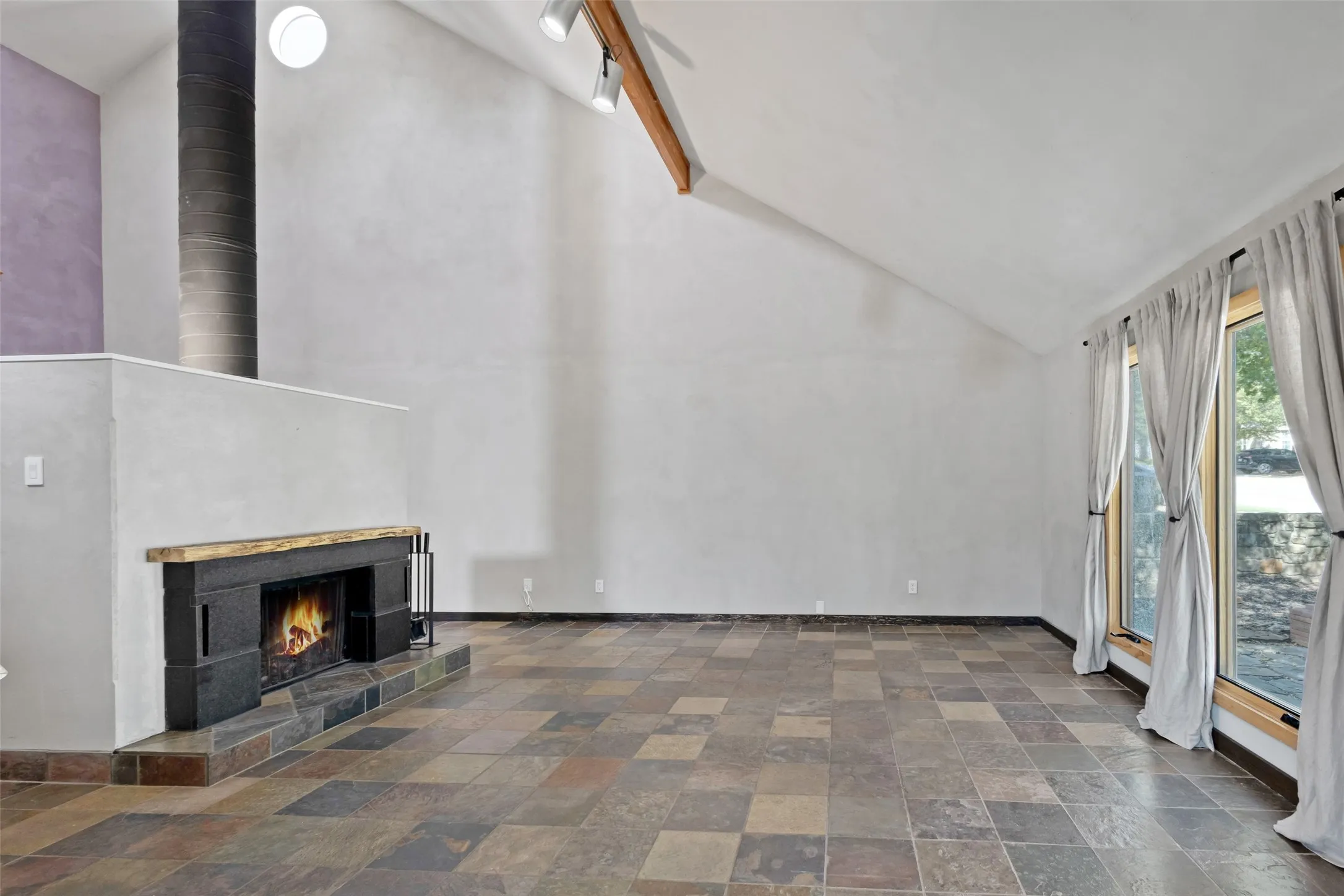 Spacious living area with fireplace