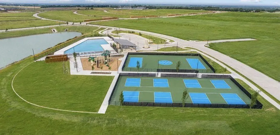 Community amenities featuring a swimming pool, playground, multiple sports courts, and a waterside walking path