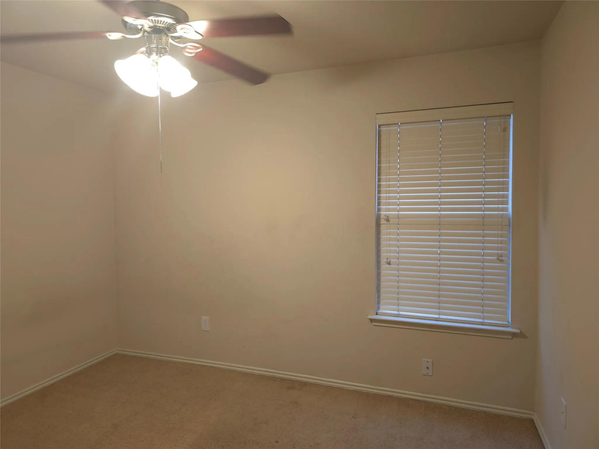 Recessed window with white blinds