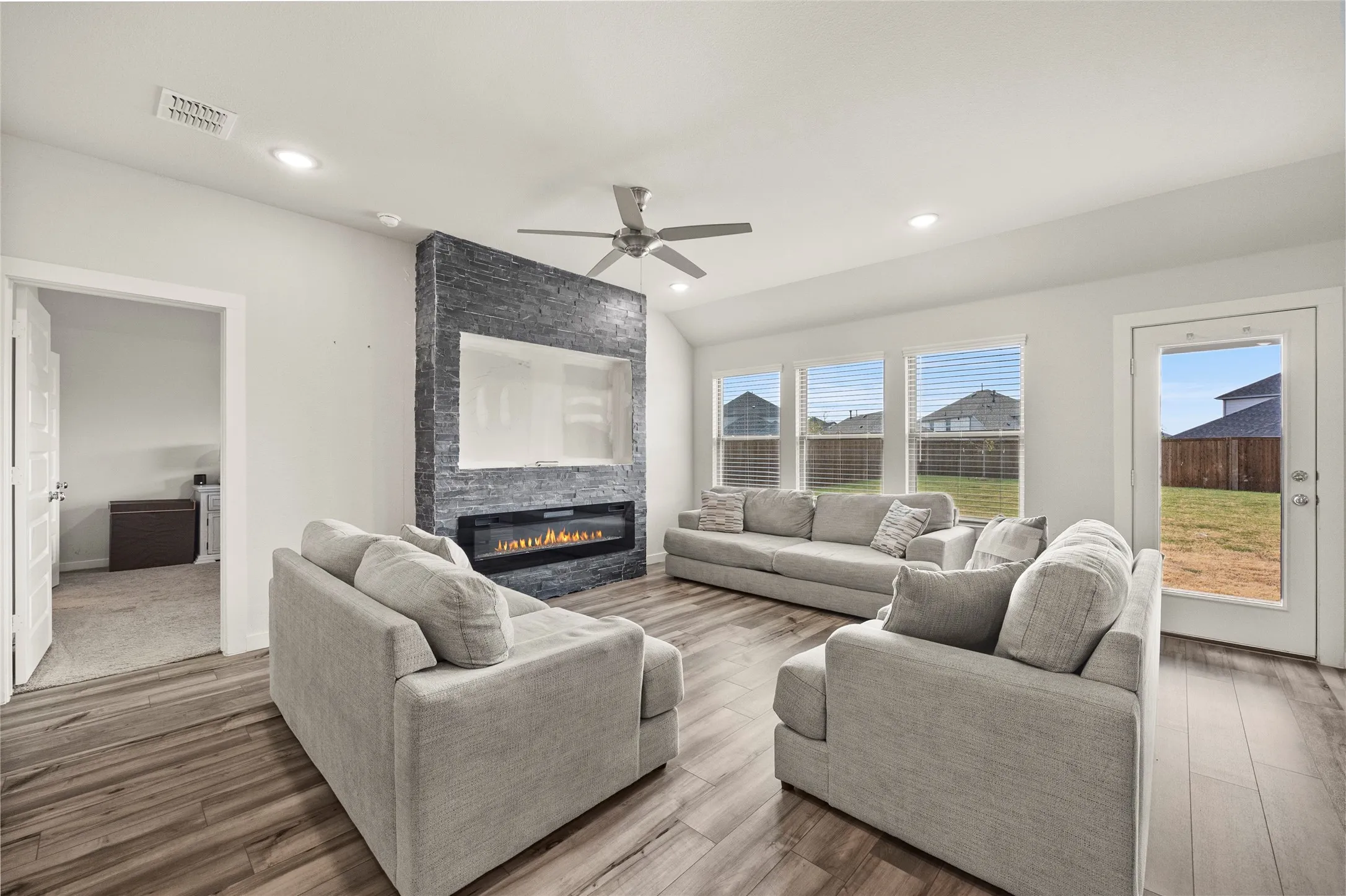 Wood-finish flooring, recessed lighting, and a ceiling fan