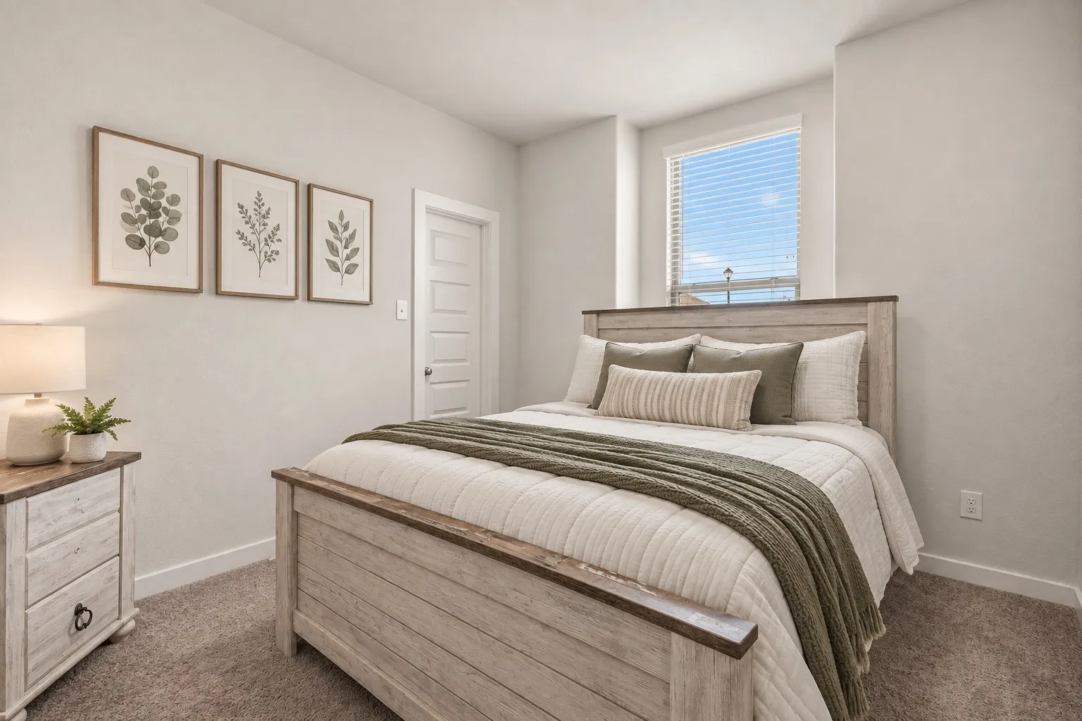 Carpeted room featuring a window with blinds and a five-panel interior door