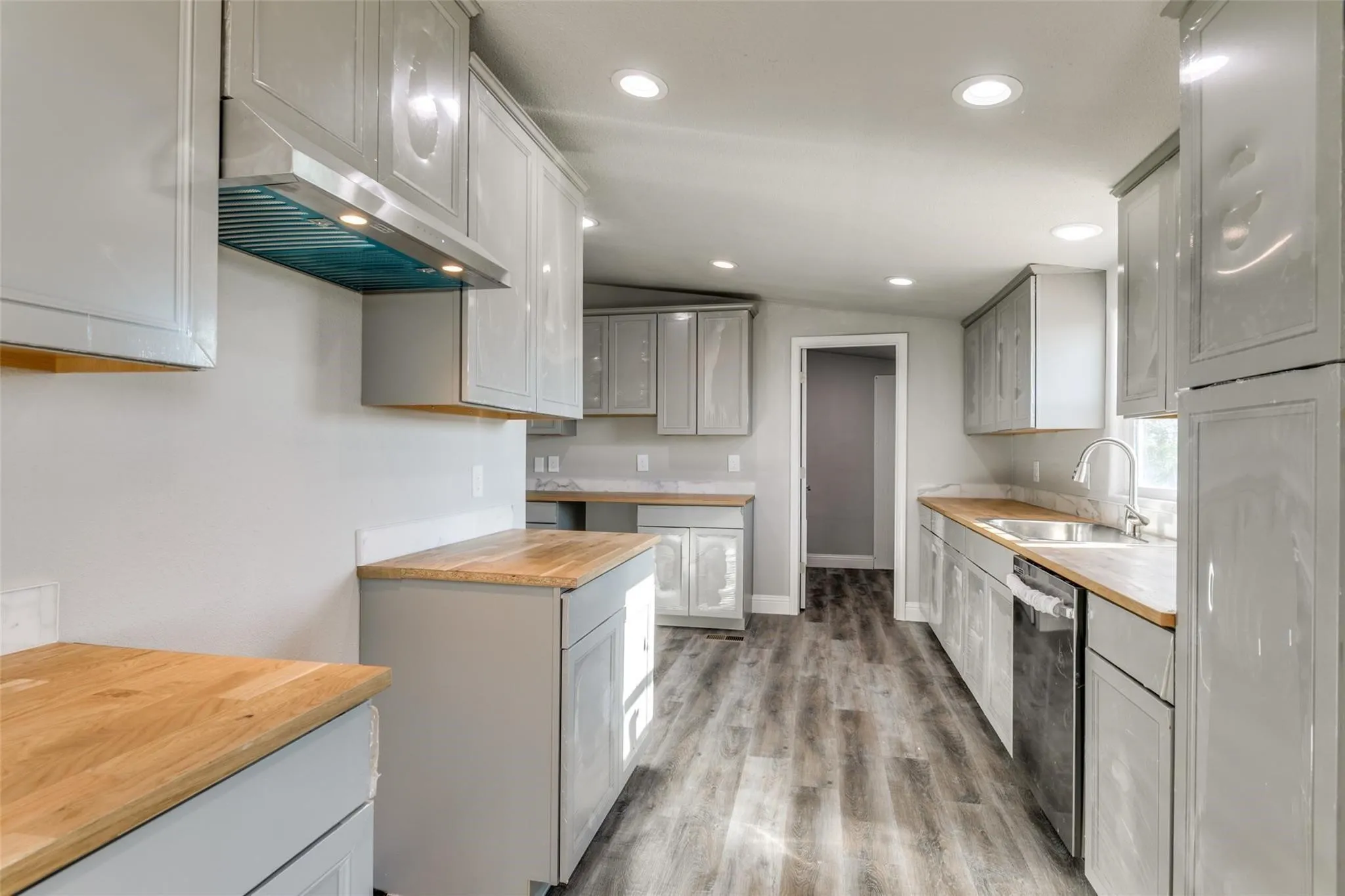 Kitchen featuring butcher block countertops.