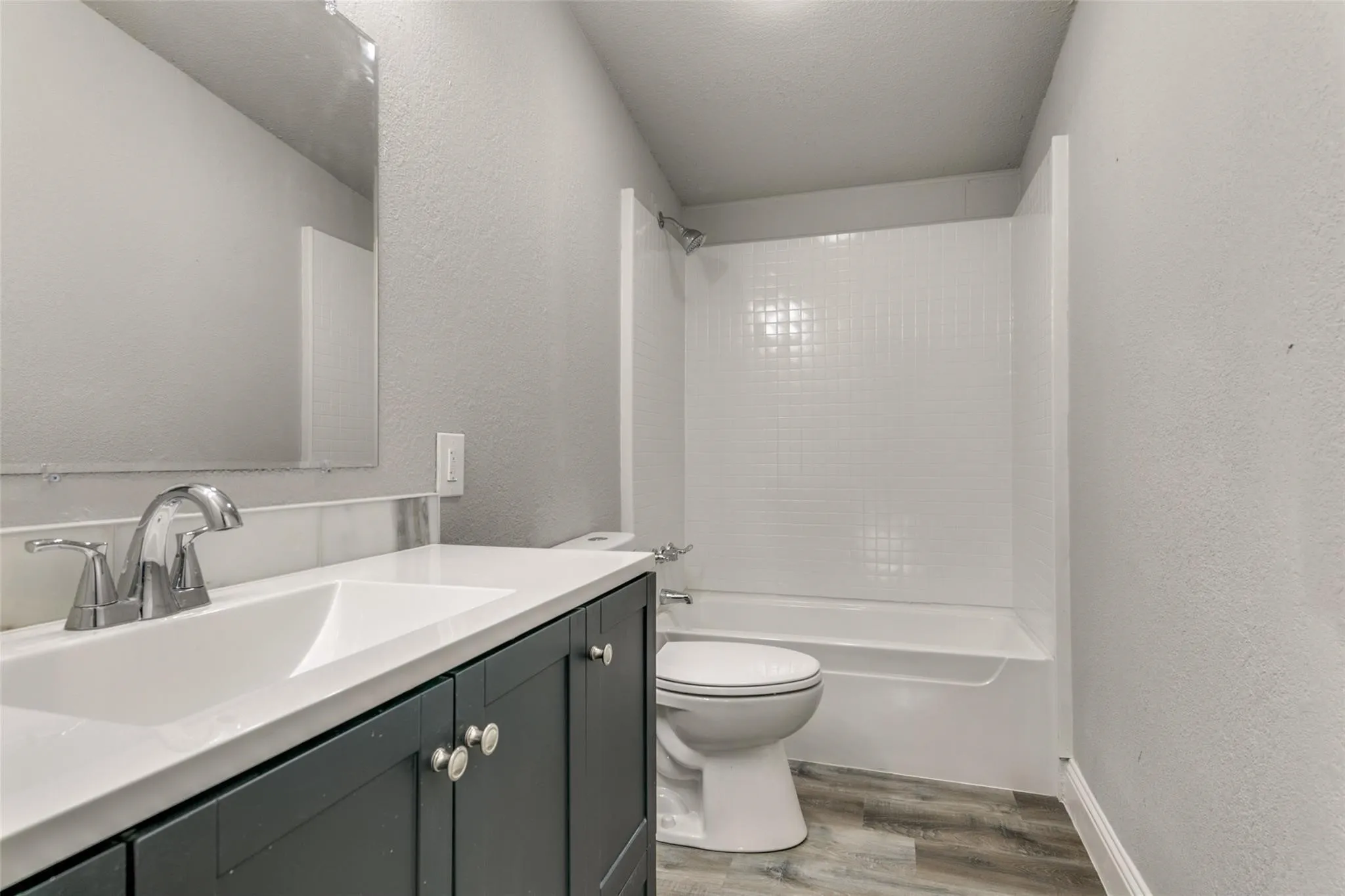 Bathroom 2 with marbel countertops and brushed nickel fixtures.