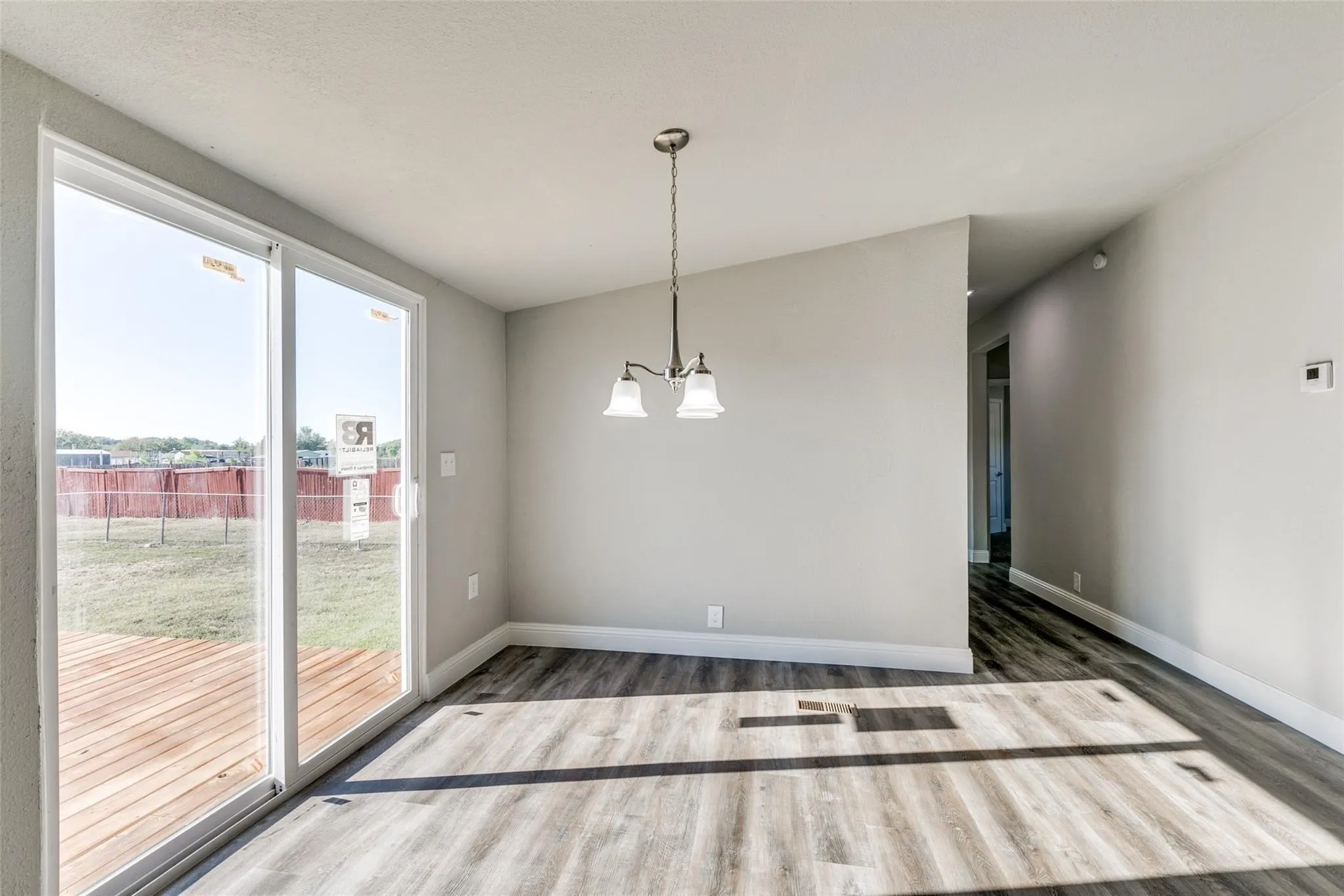 Dining room with sliding glass door that leads out to a huge deck.