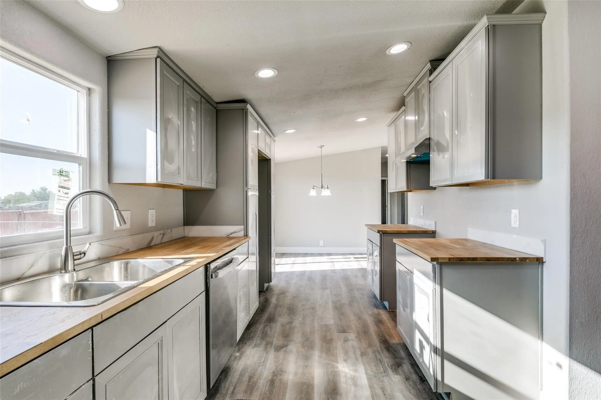Kitchen- solid wood cabinetry and brushed nickel fixtures.