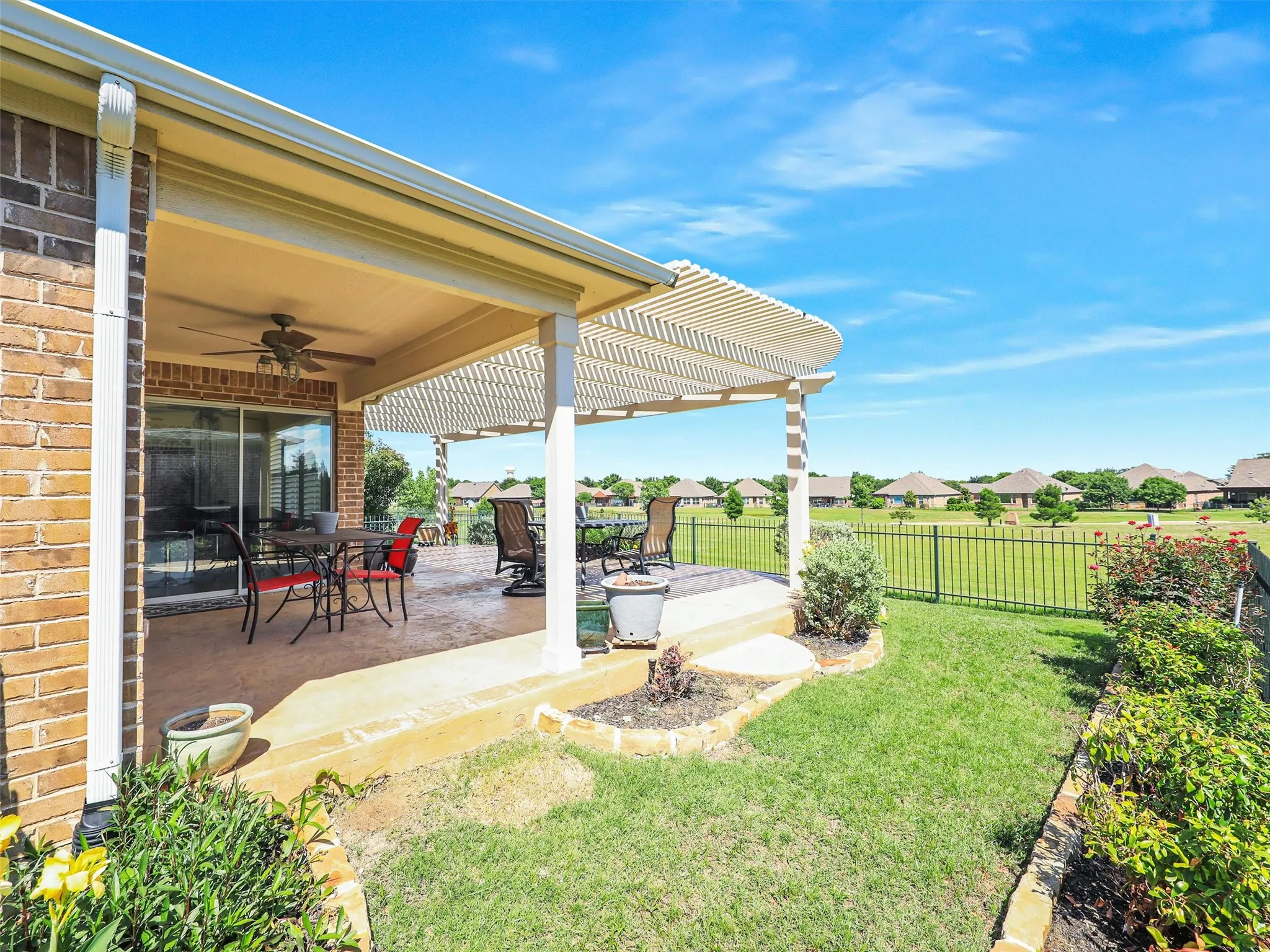 View of yard with a pergola, a patio, and ceiling fan