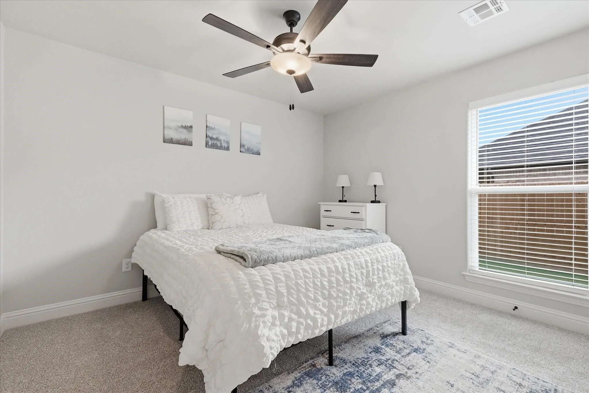 Recessed lighting, ceiling fan with integrated light fixture, carpet flooring, window with blinds, and white trim