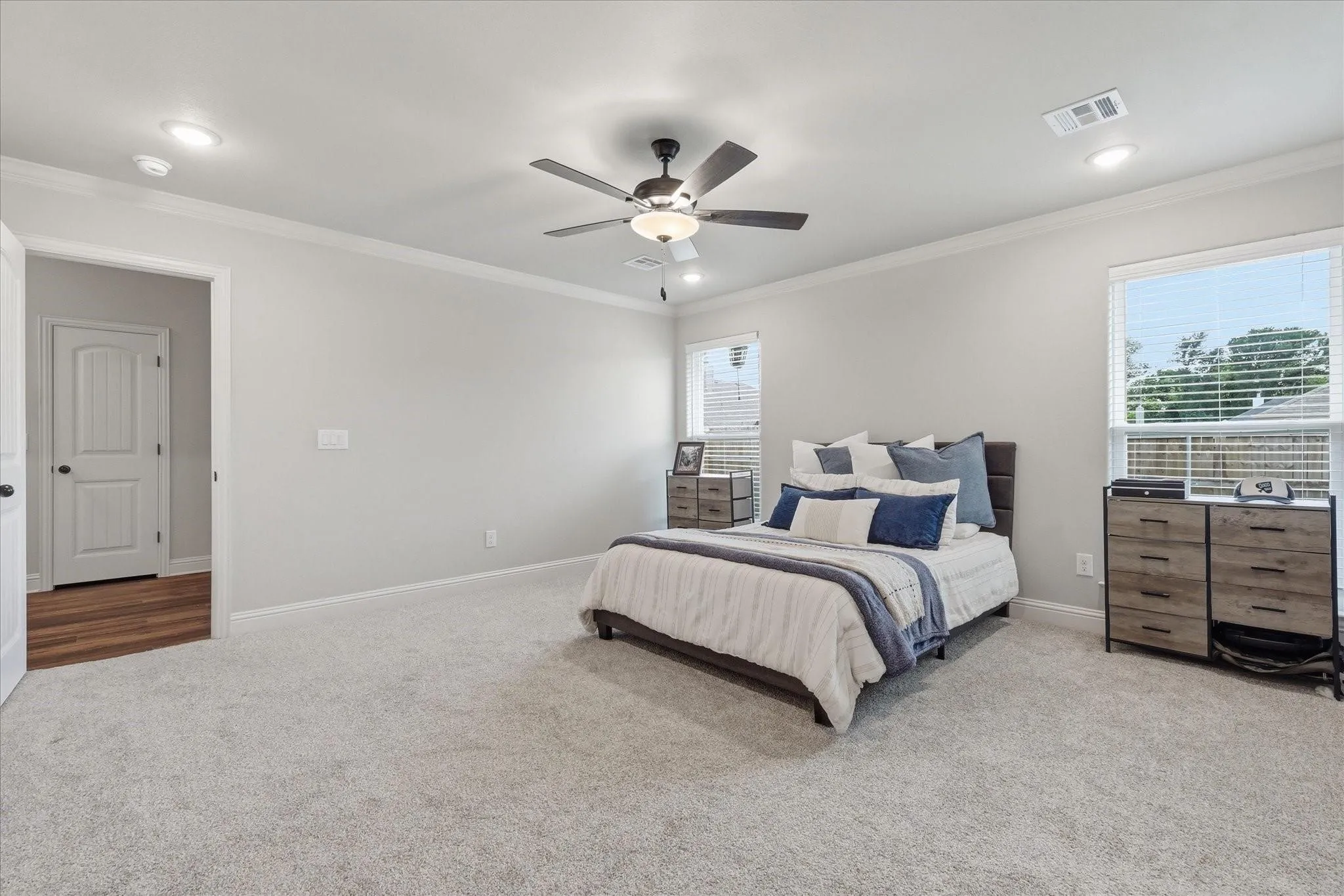 Light gray wall paint with white crown molding