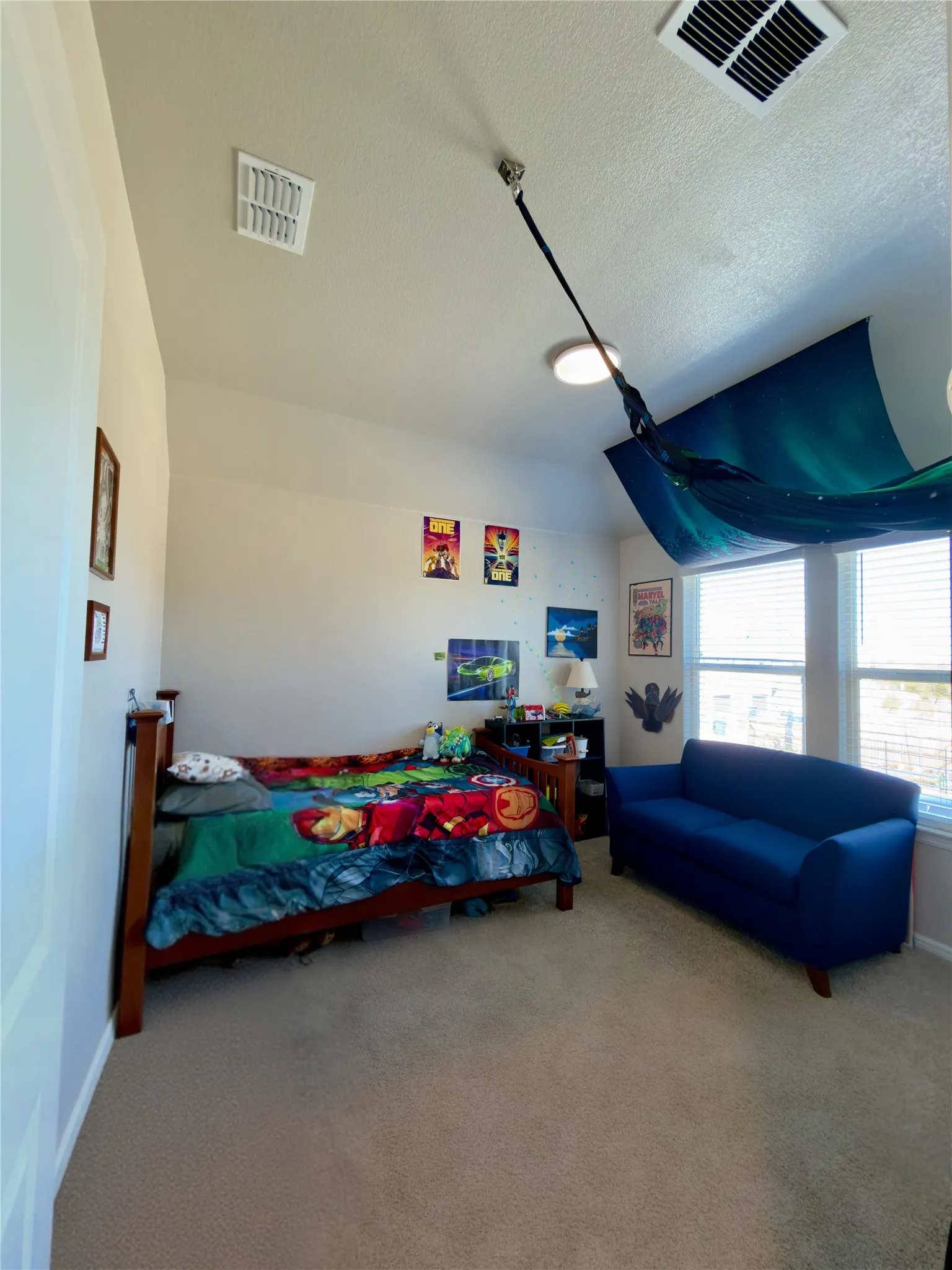 Bedroom featuring carpet flooring and baseboards