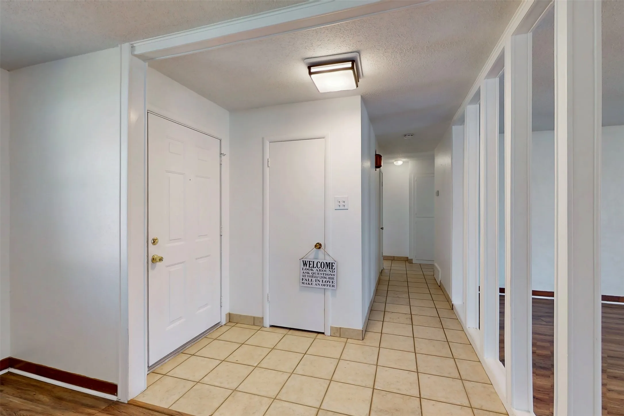 A tiled path leads to the bedrooms and bathrooms.