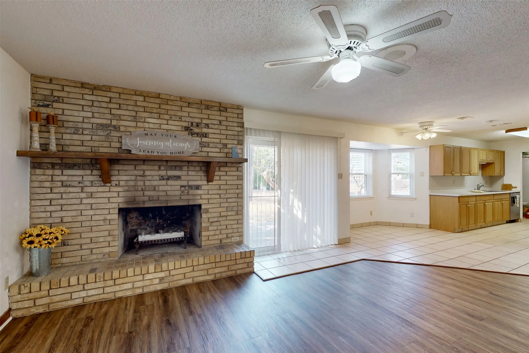 Living area is open to the breakfast nook and kitchen, with access to the back patio.