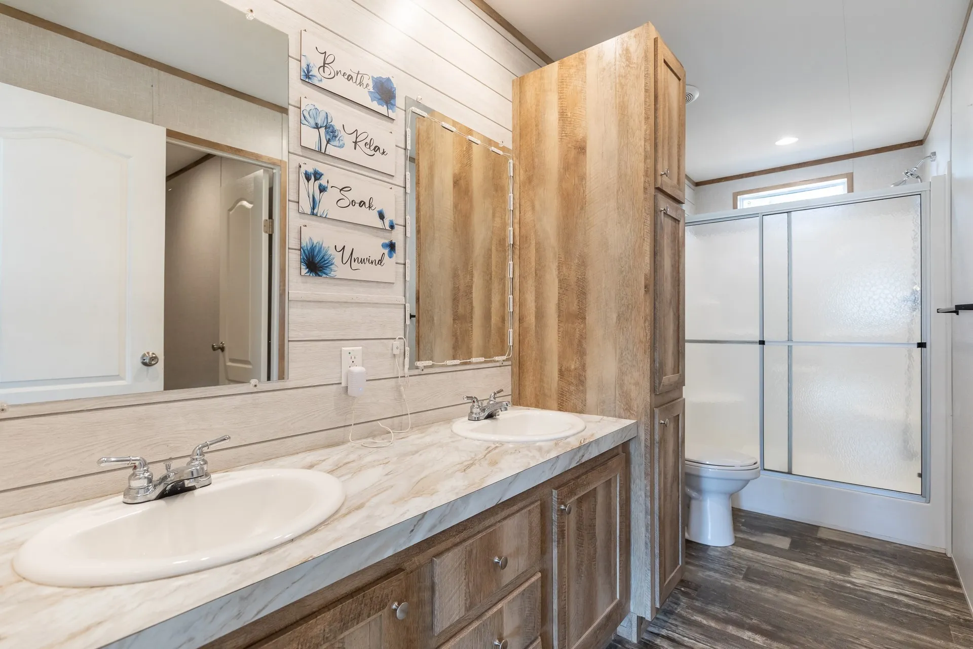 Dual vanity with chrome fixtures and integrated sinks