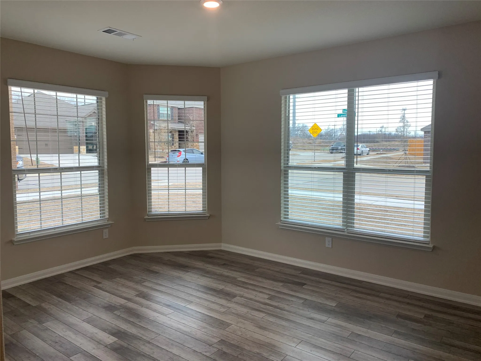 Wood-finish flooring with a multi-pane window