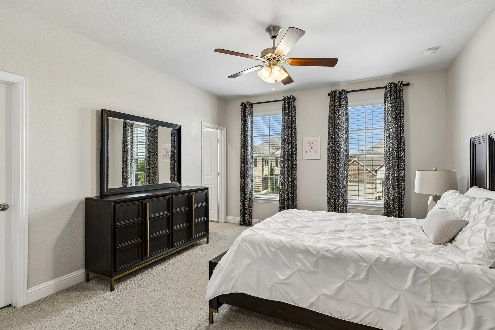 Spacious Bedroom #4 with an en-suite bath upstairs features walk in closet
