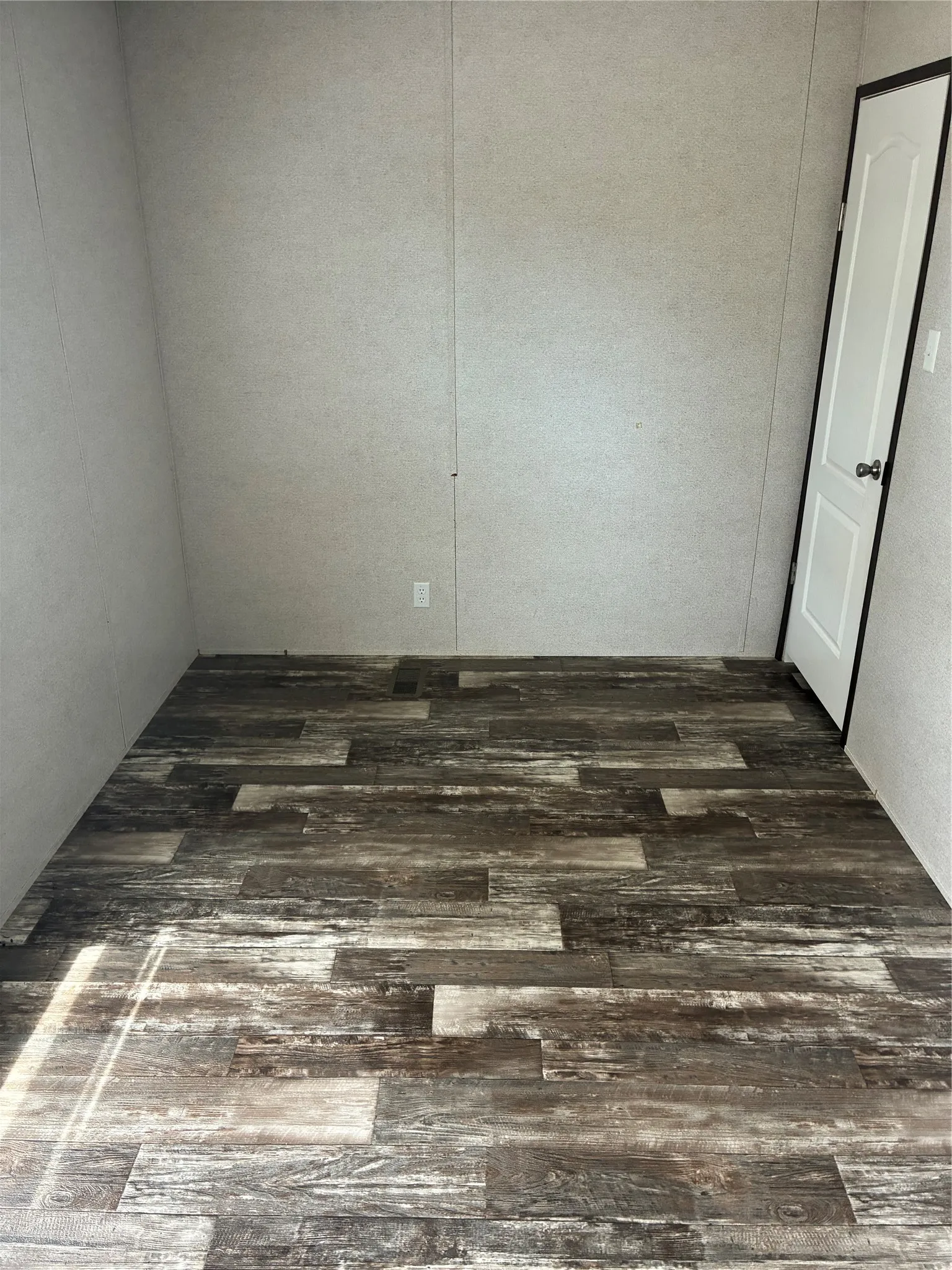 Wood-finish plank flooring throughout