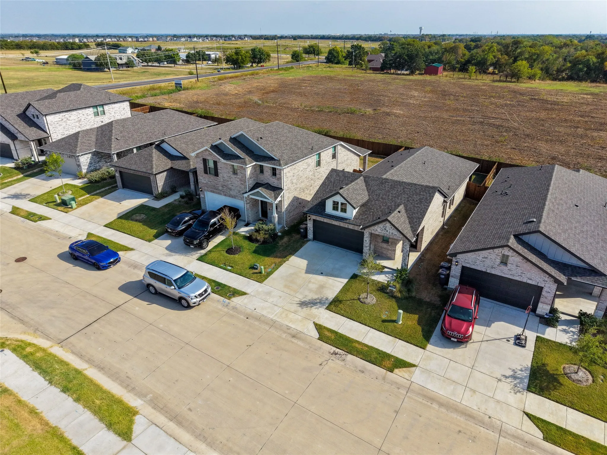 Modern residential architecture with varied rooflines and a concrete driveway