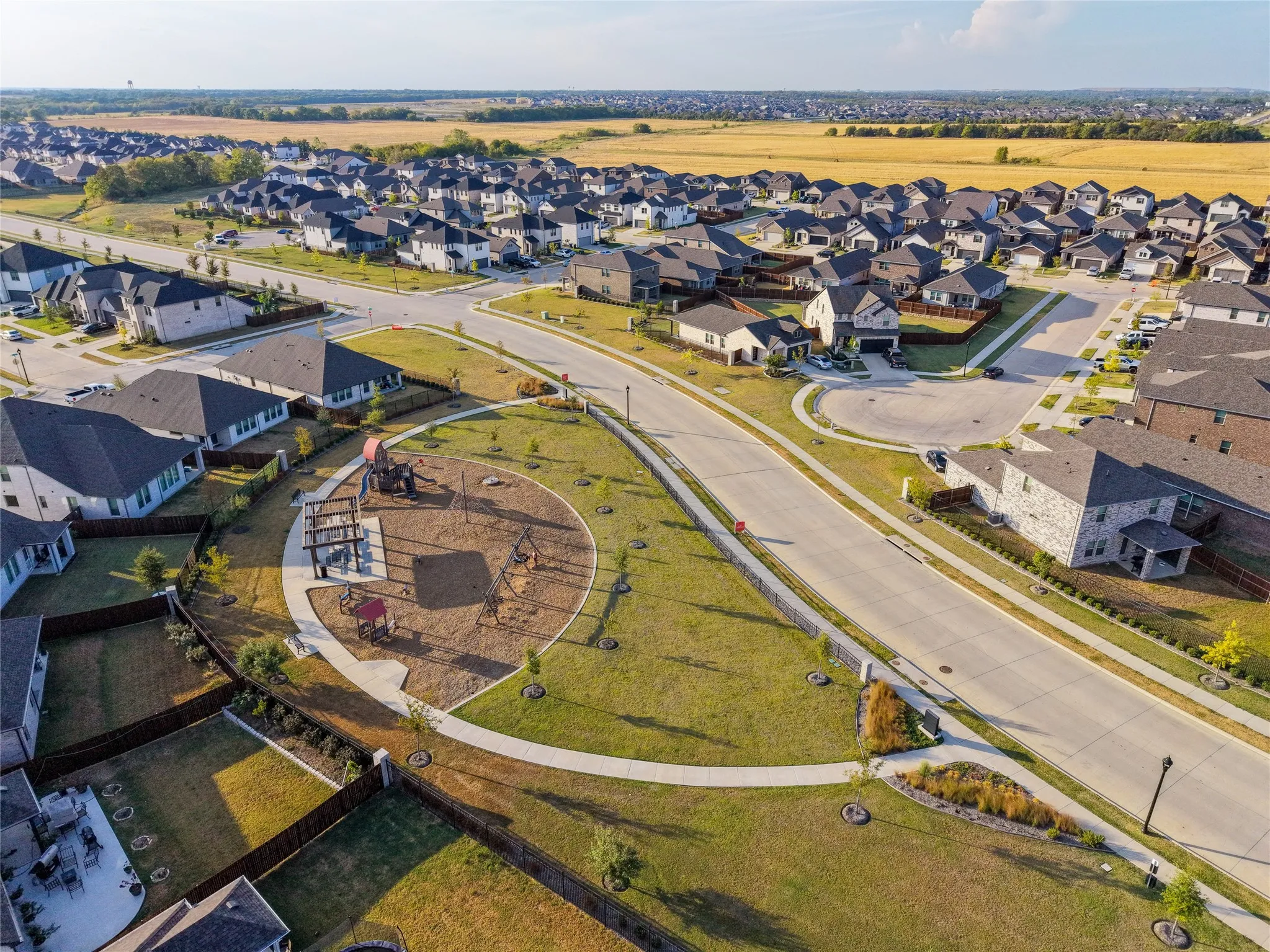 Neighborhood featuring an integrated park space, paved roads, and sidewalks