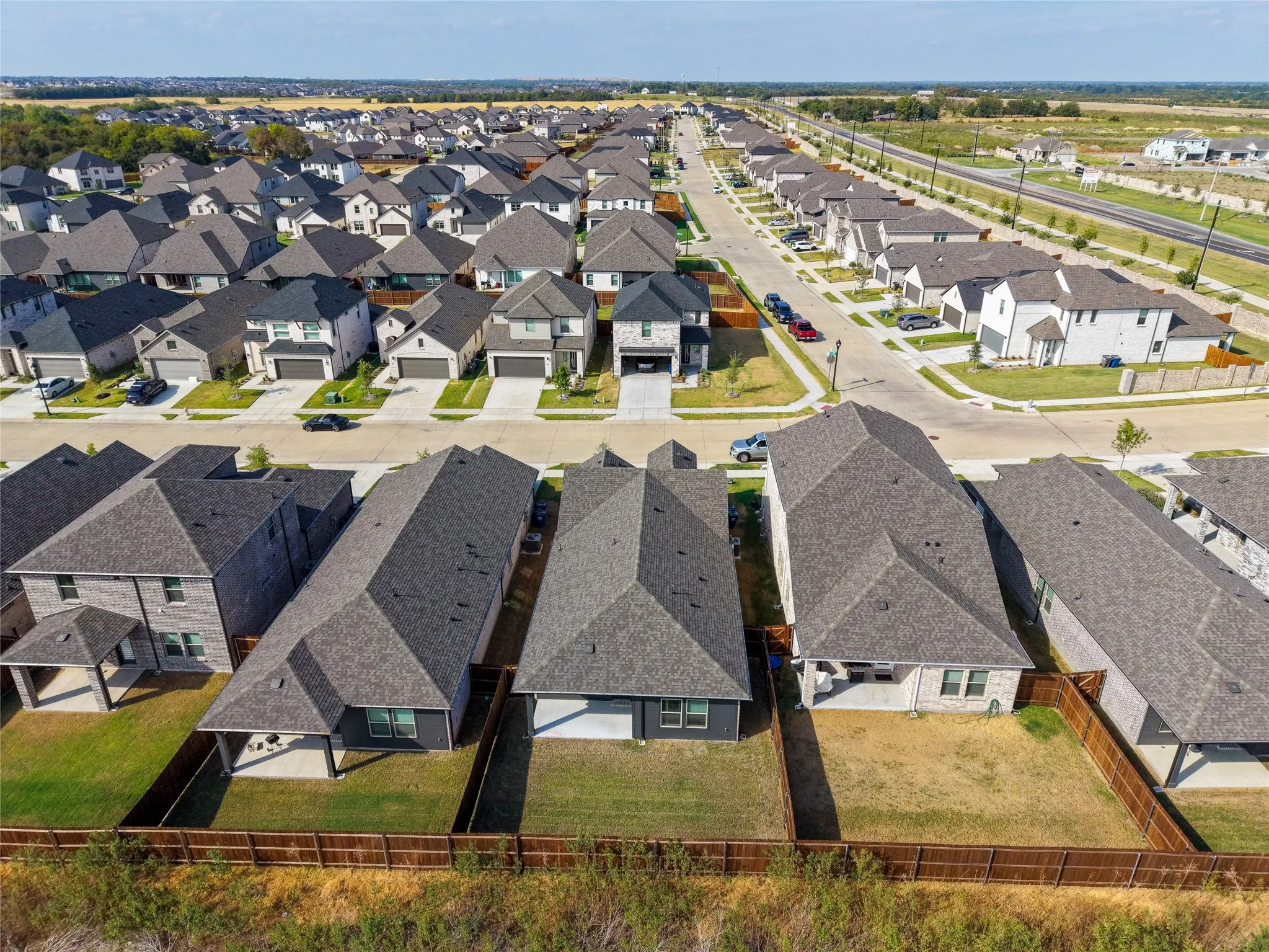Newly developed residential community with consistent architectural styling and landscaped frontages