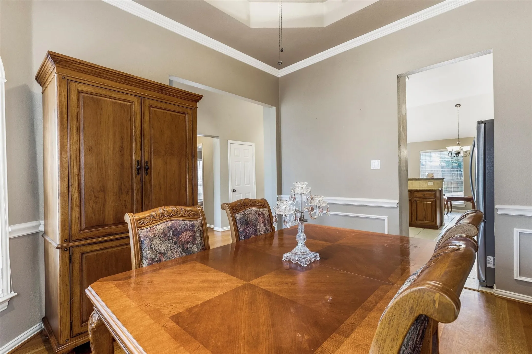Tray ceiling detail, crown molding, chair rail, and baseboard trim