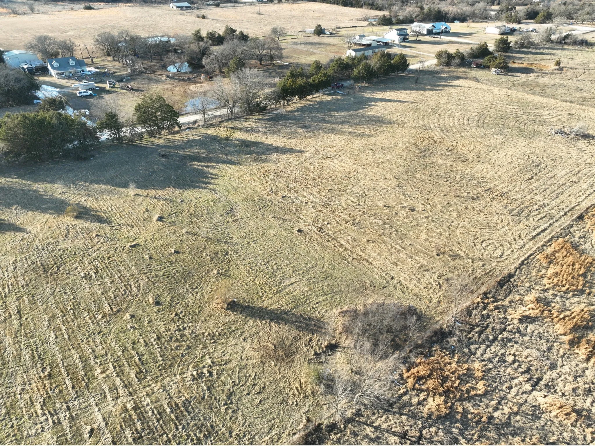 Expansive land parcel with partial fencing and varying ground​​‌​​​​‌​​‌‌​‌‌​​​‌‌​‌​‌​‌​​​‌​​ cover