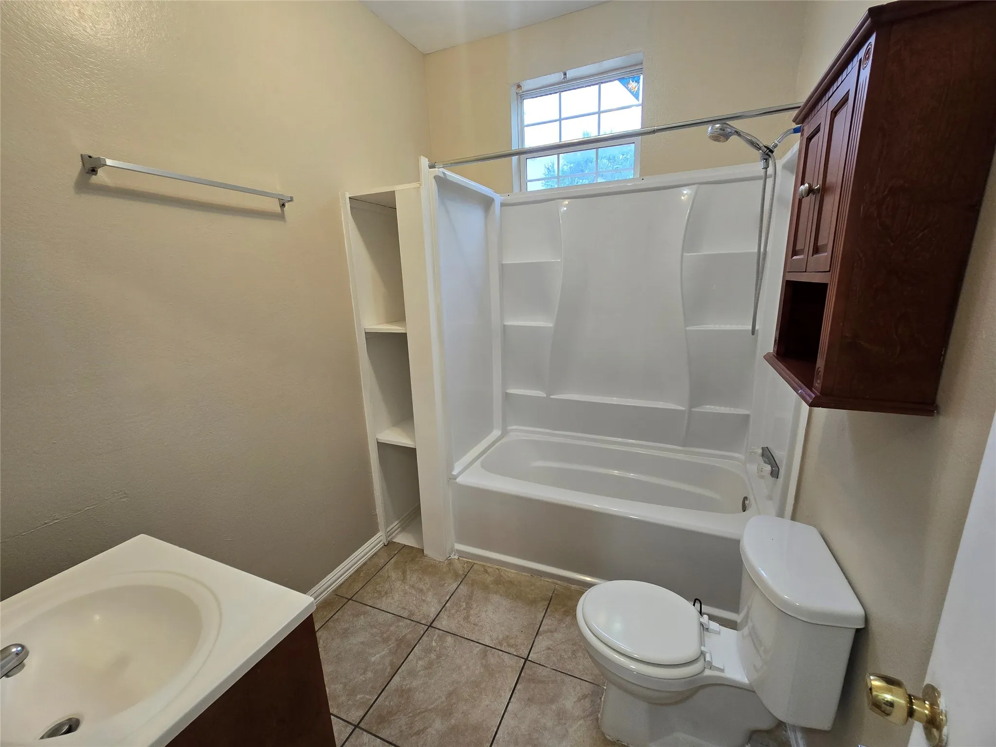 Full bath with shower / bathtub combination, tile patterned flooring, and vanity