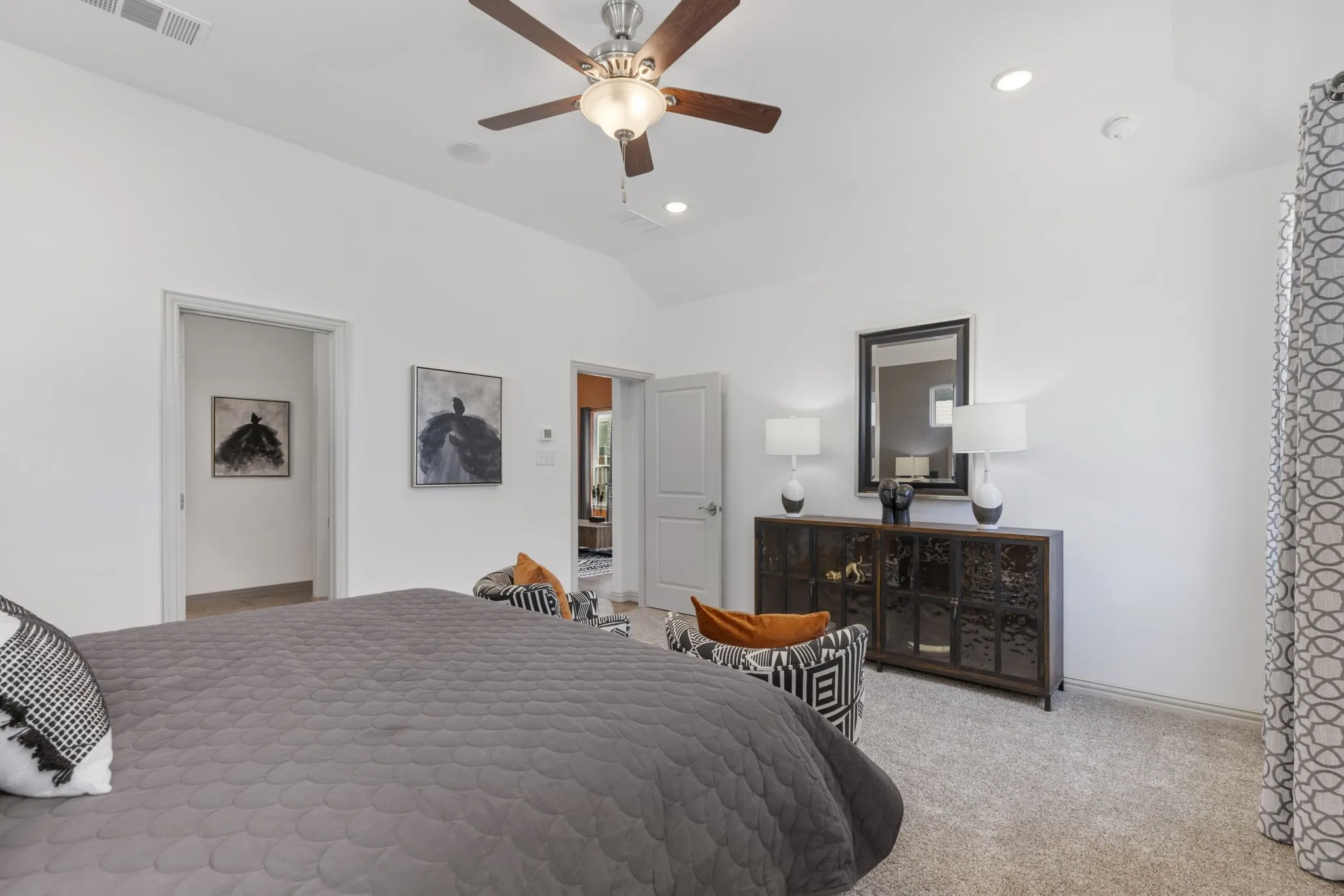 Vaulted ceiling with a ceiling fan, recessed lighting, and carpet flooring