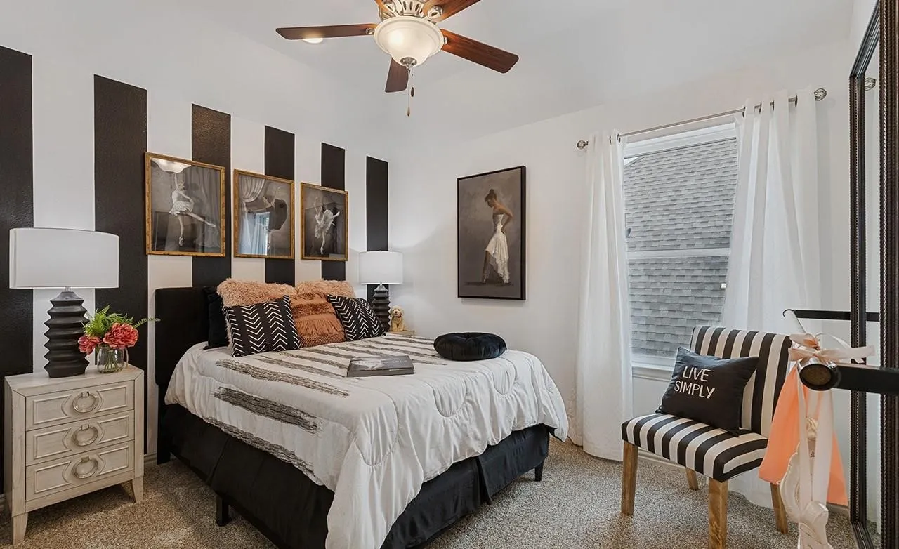 White wall with black vertical stripes