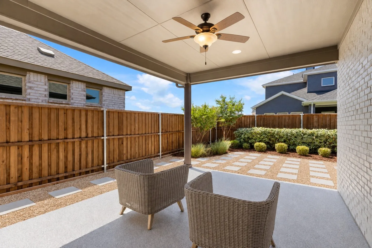 Covered patio featuring a ceiling fan with integrated lighting