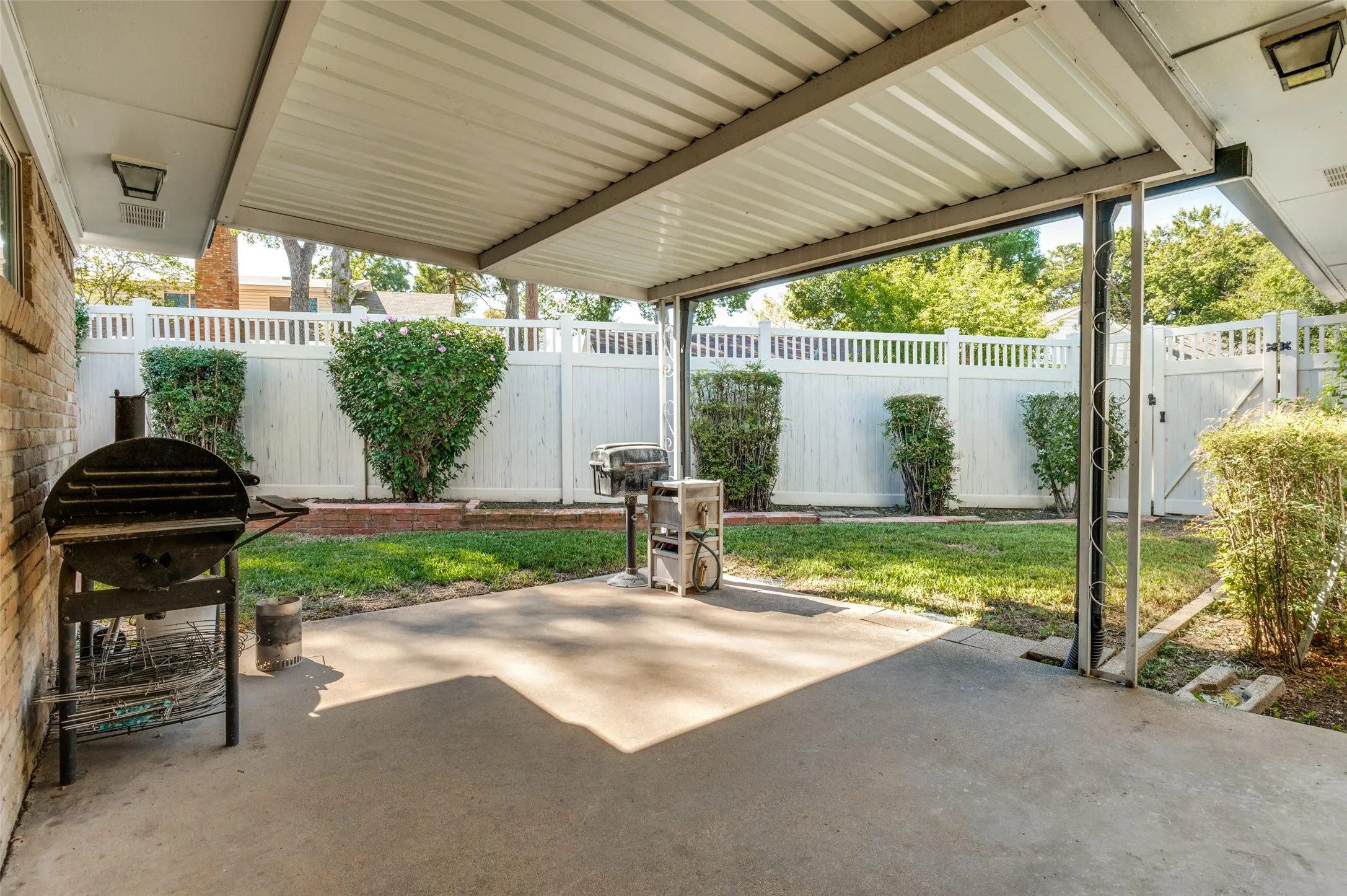 Covered patio featuring a concrete slab and direct access to the backyard
